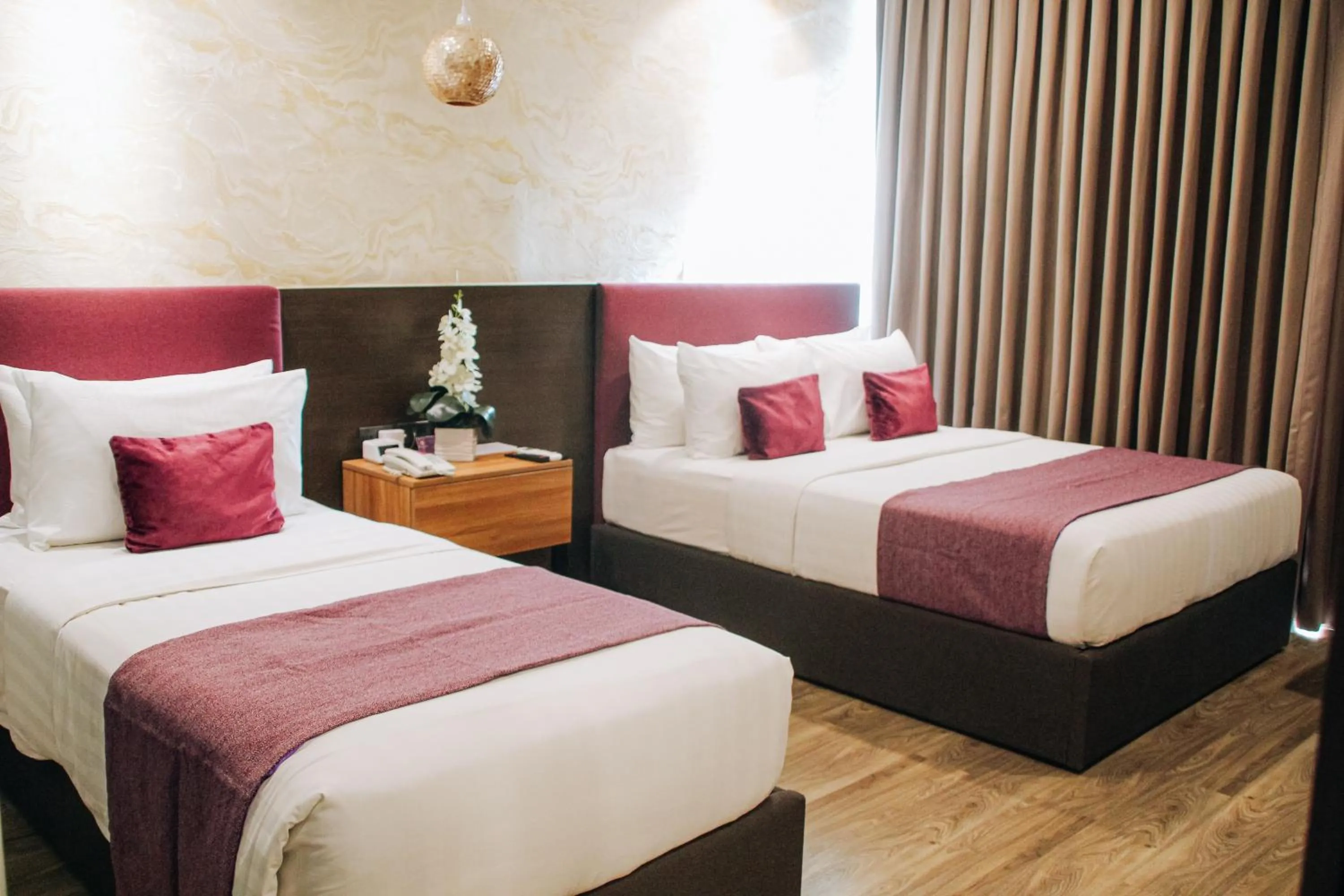 Bed in Goldberry Suites and Hotel Cebu