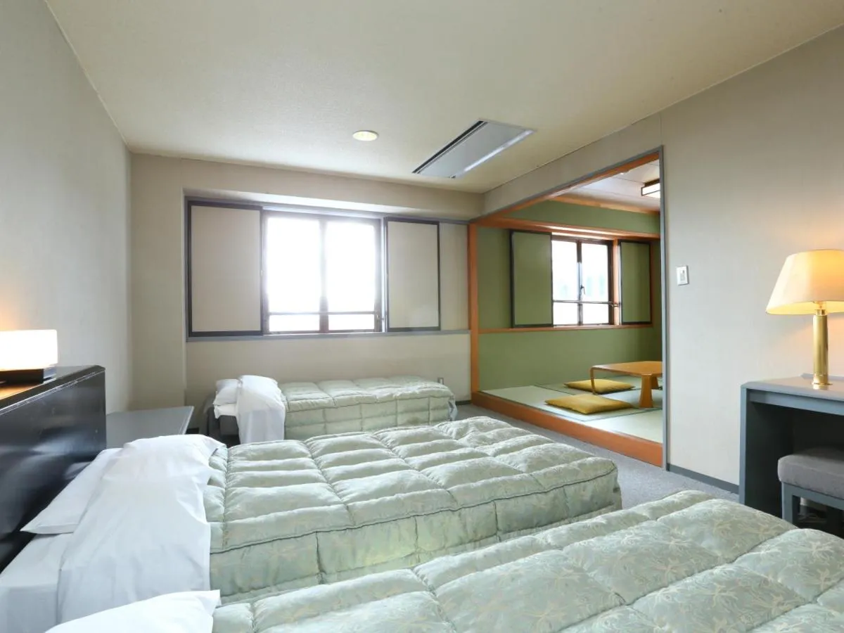 Photo of the whole room, Bed in Hotel Silk Inn Madarao