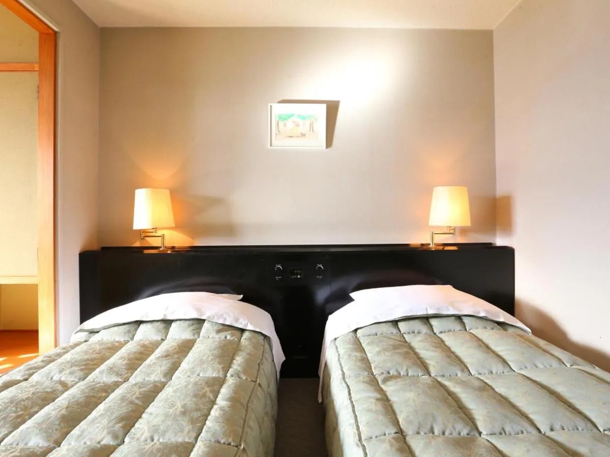 Photo of the whole room, Bed in Hotel Silk Inn Madarao