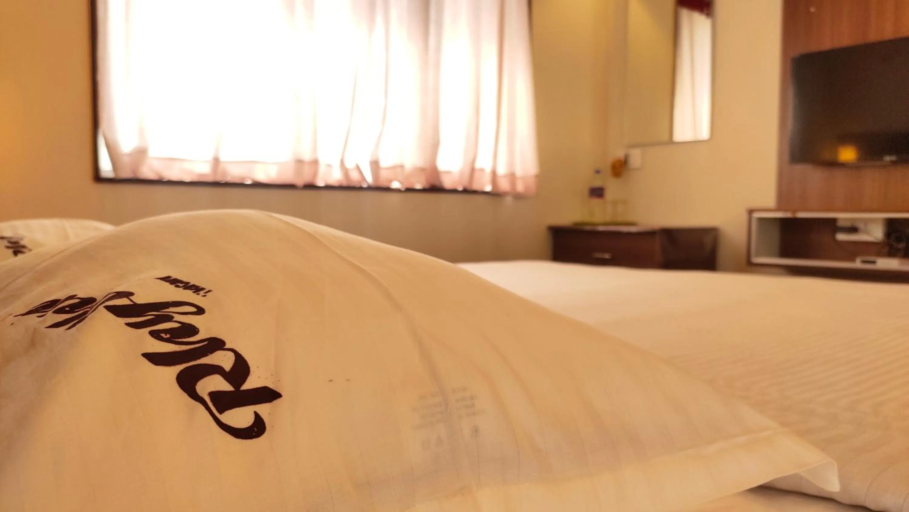 Bed in Hotel Rhythm Grand Suite