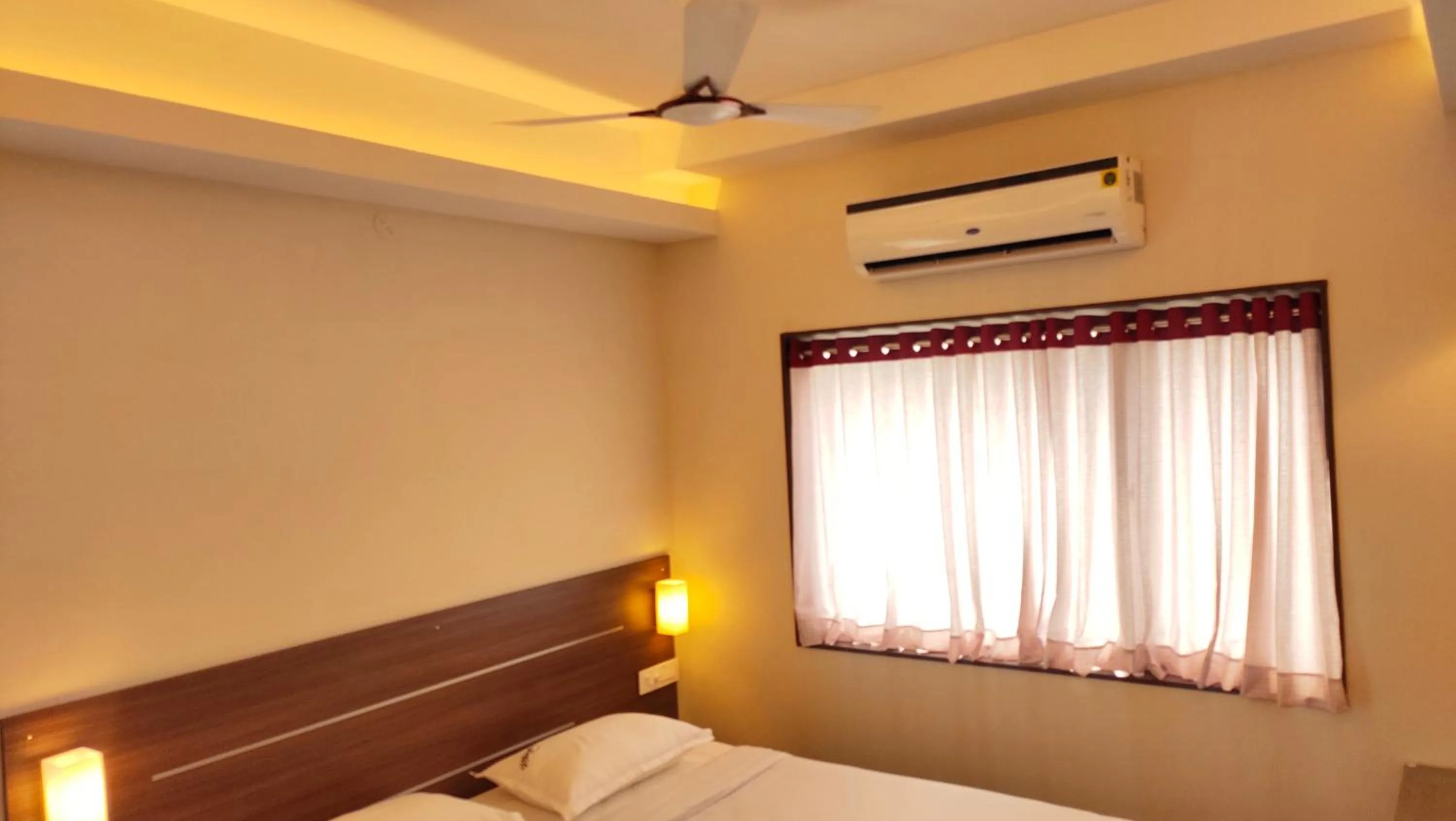 Bed in Hotel Rhythm Grand Suite