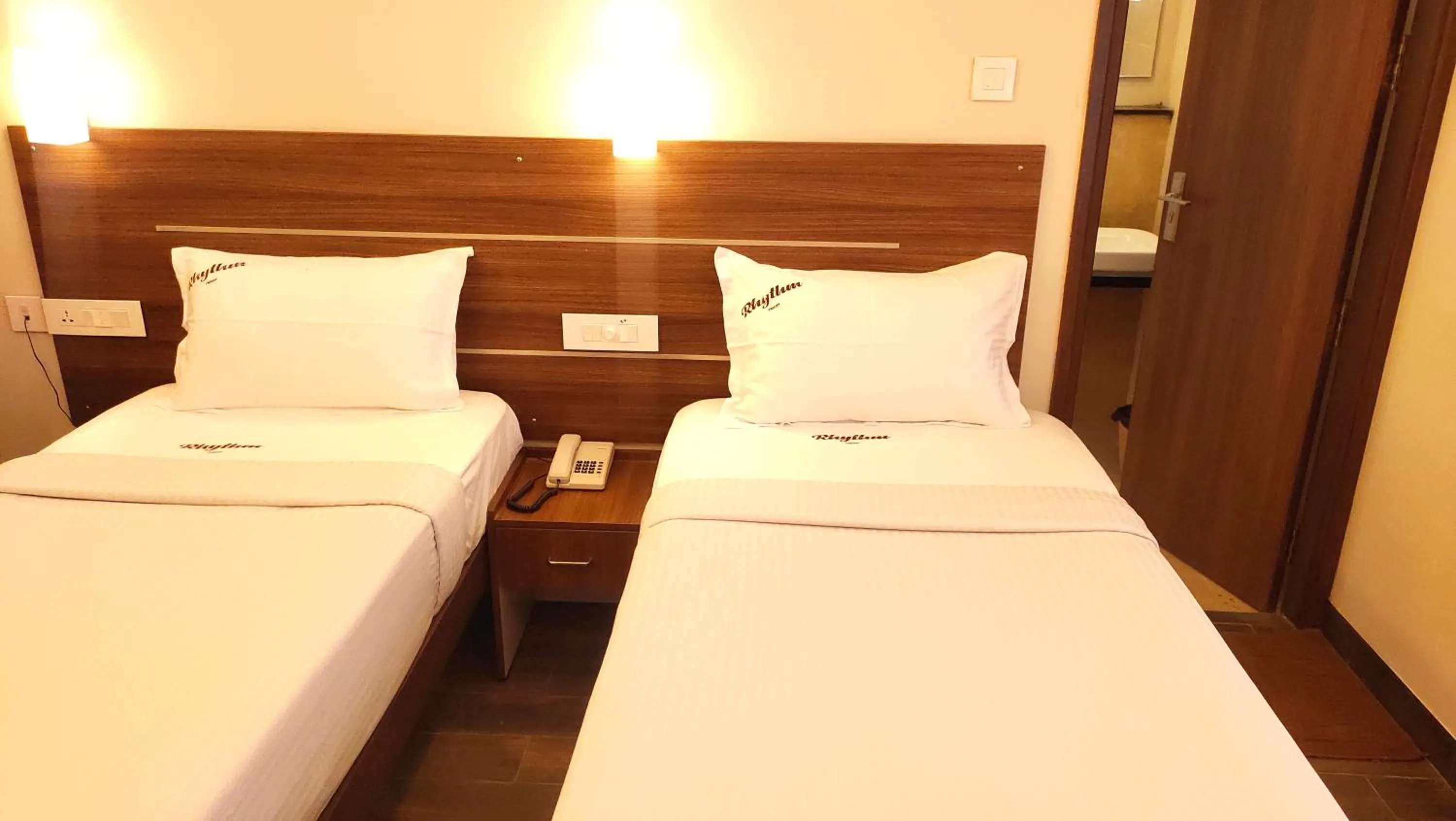 Bed in Hotel Rhythm Grand Suite