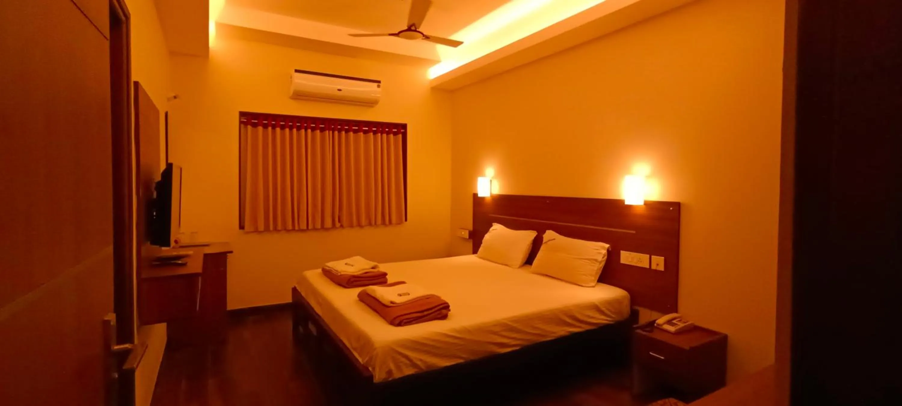 Bed in Hotel Rhythm Grand Suite