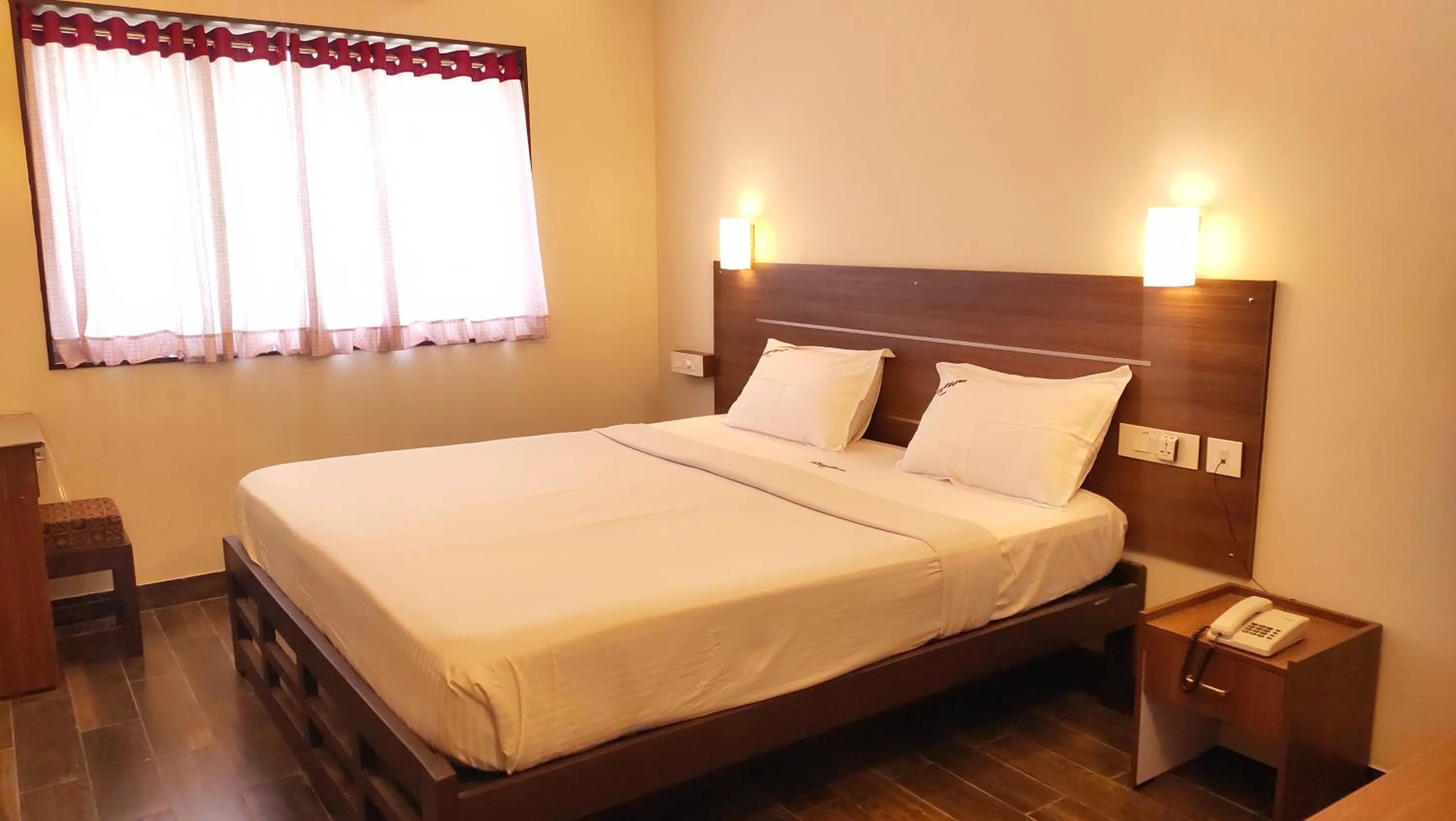 Bed in Hotel Rhythm Grand Suite