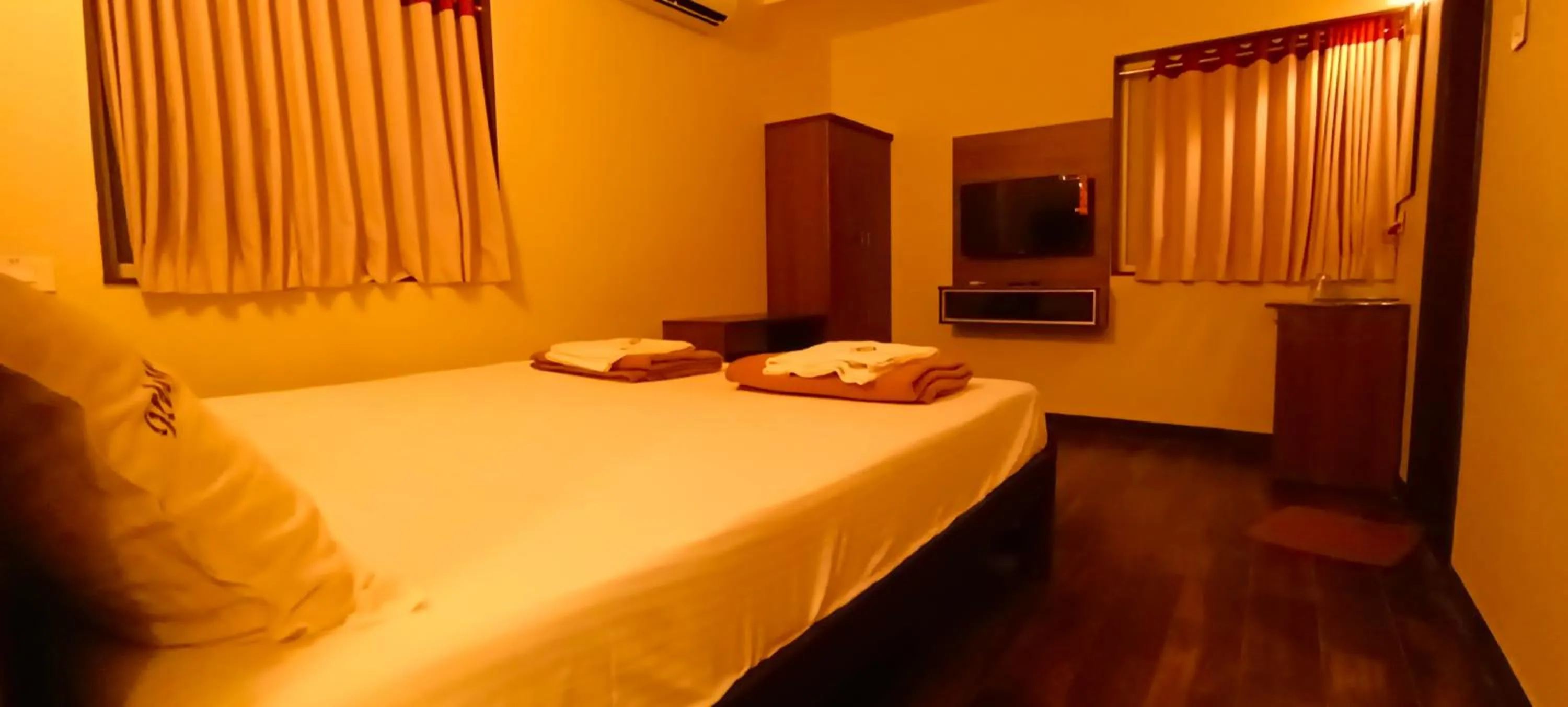 Bed in Hotel Rhythm Grand Suite