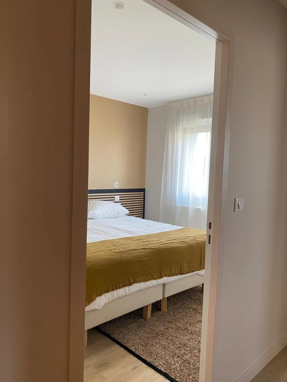 Bed in La Cremaillere Hôtel-Restaurant