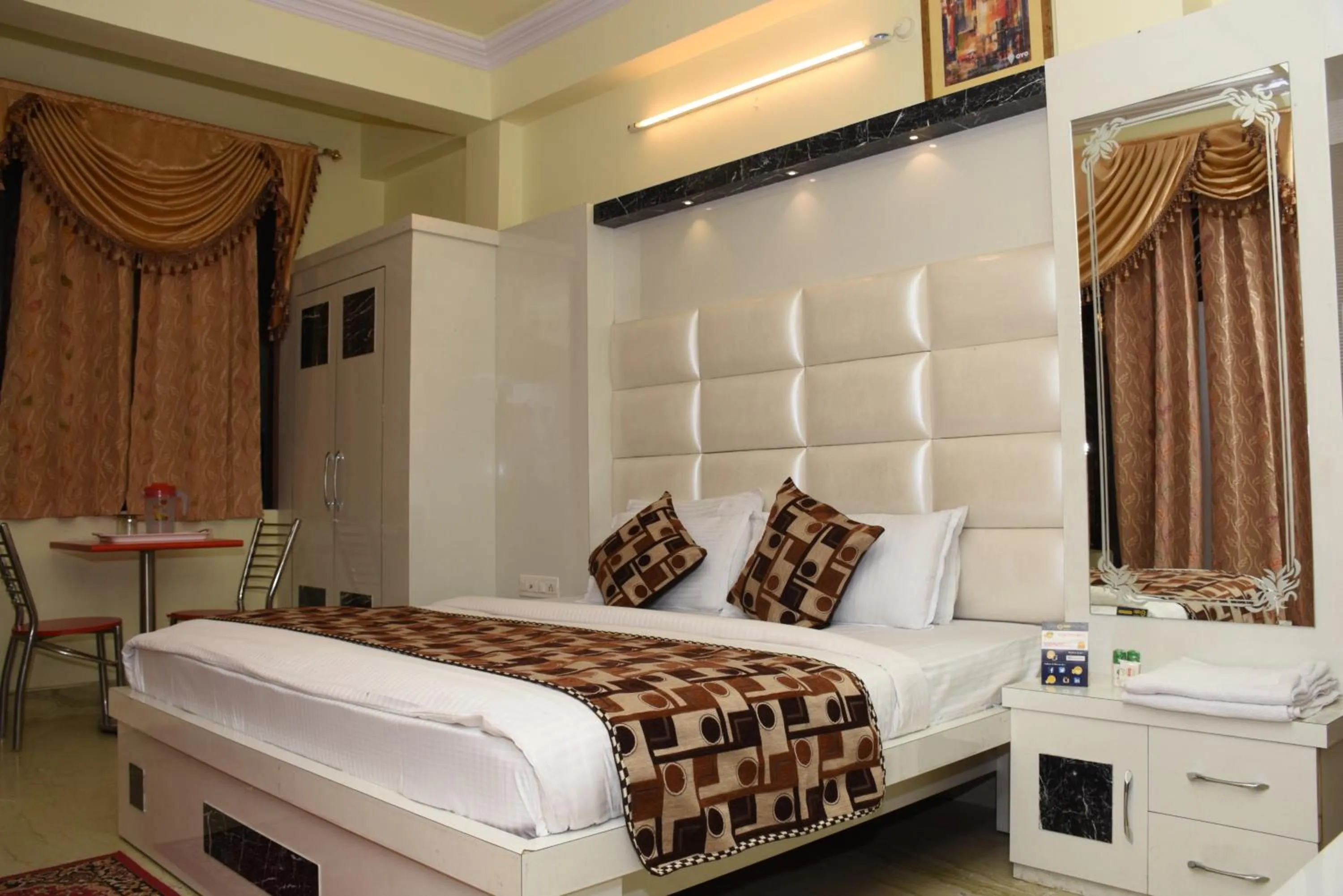 Photo of the whole room, Bed in Ganpati Plaza Hotel