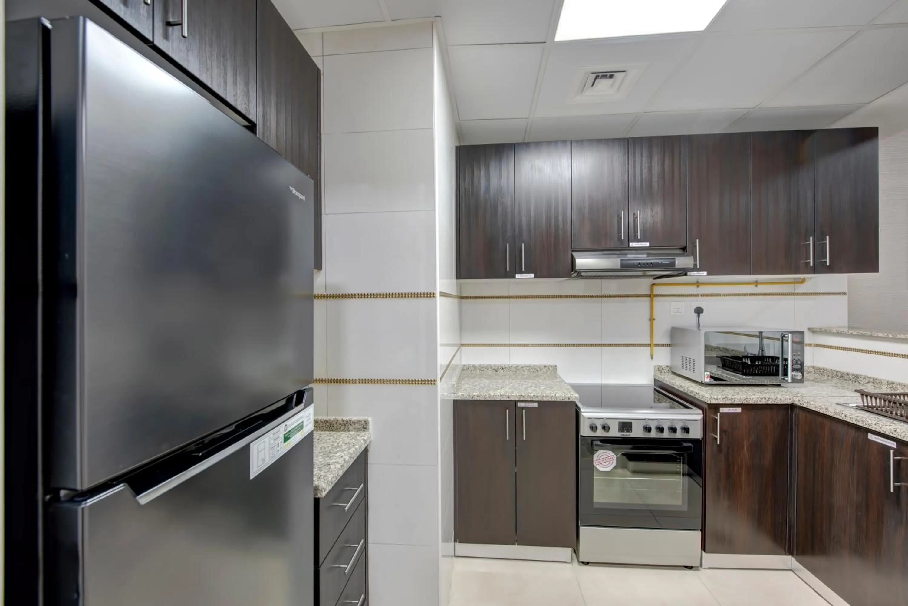 Kitchen or kitchenette in Royal Regency Suites Marina