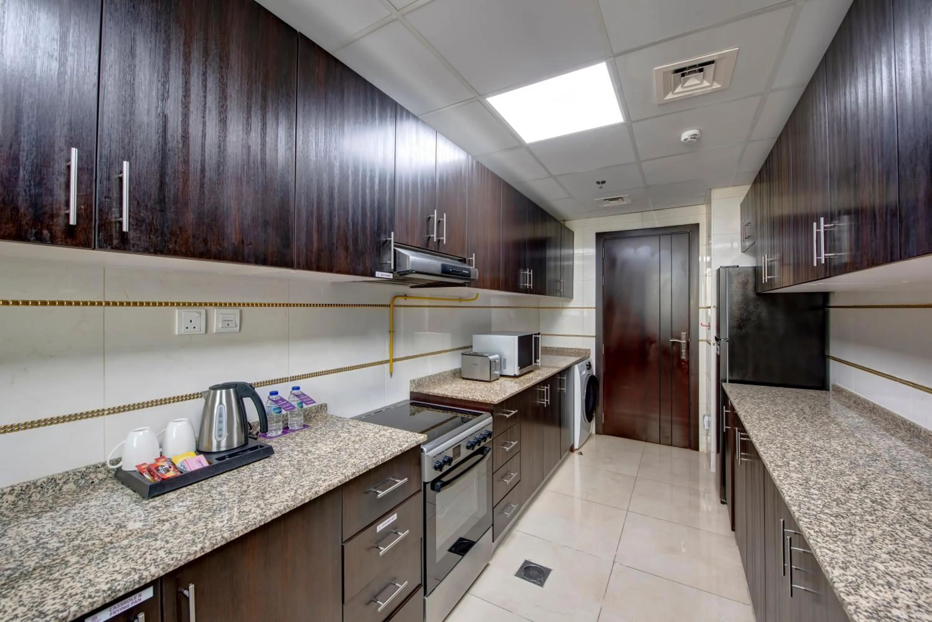 Kitchen or kitchenette in Royal Regency Suites Marina