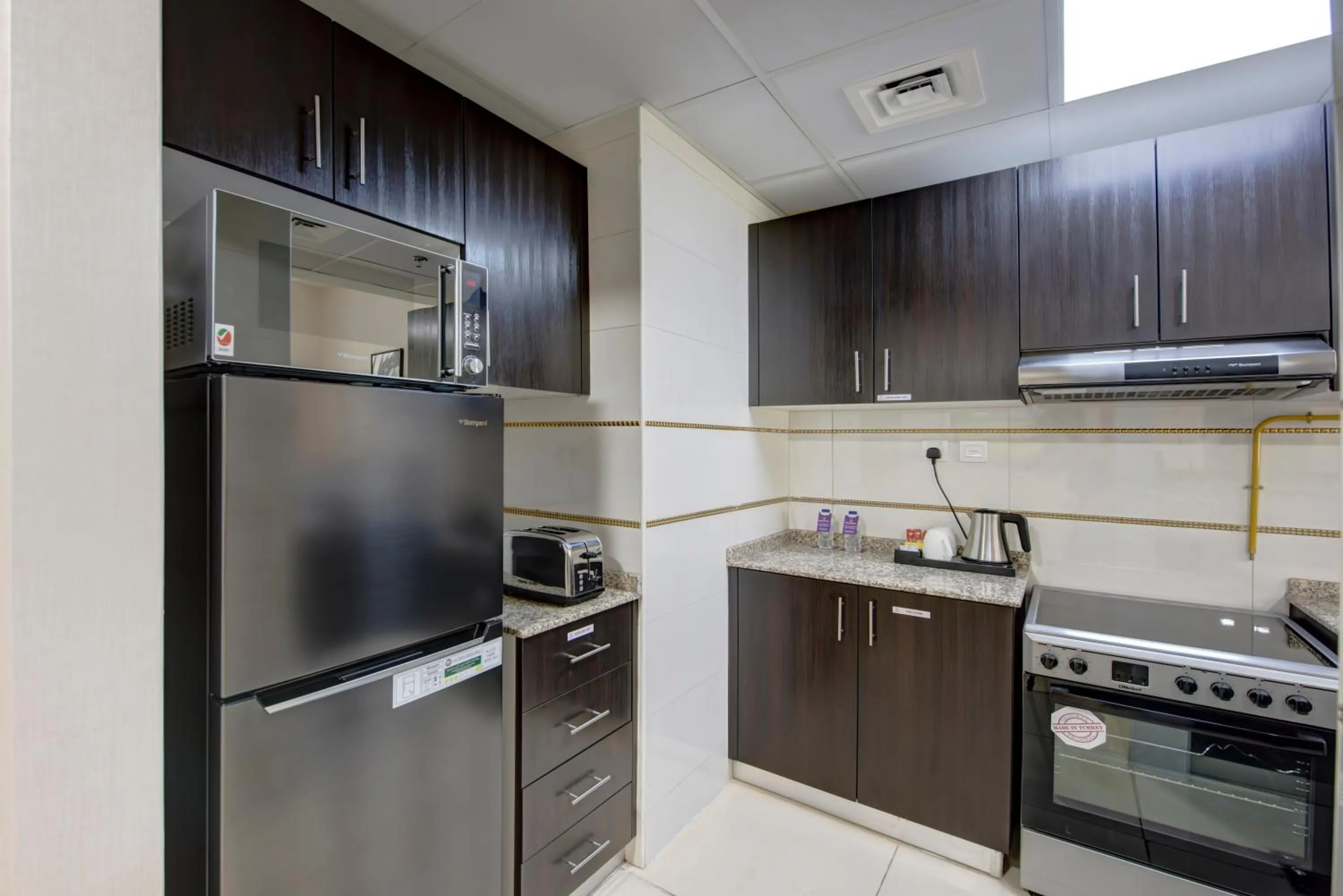 Kitchen or kitchenette in Royal Regency Suites Marina