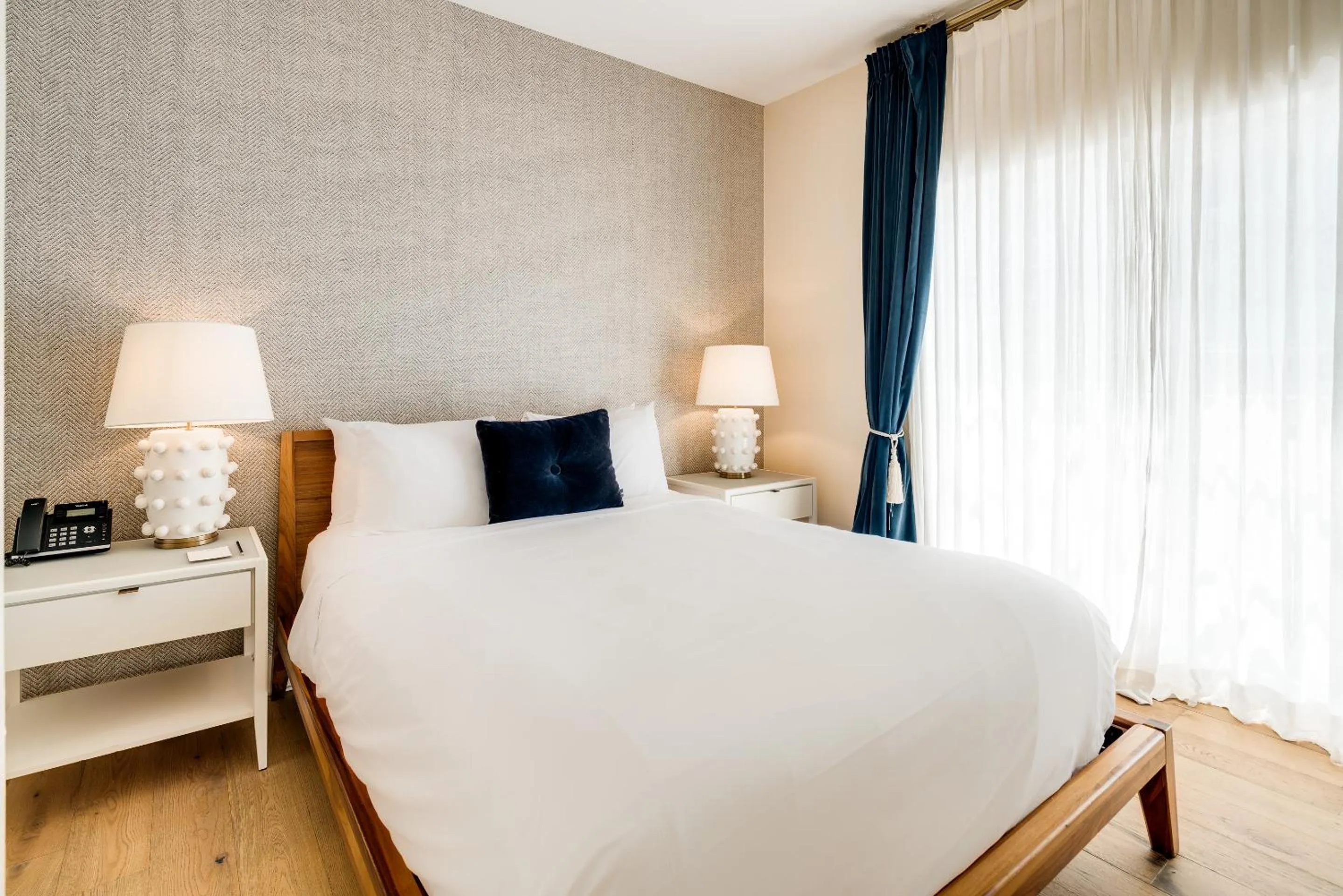 Bed in The Savoy Hotel & Beach Club