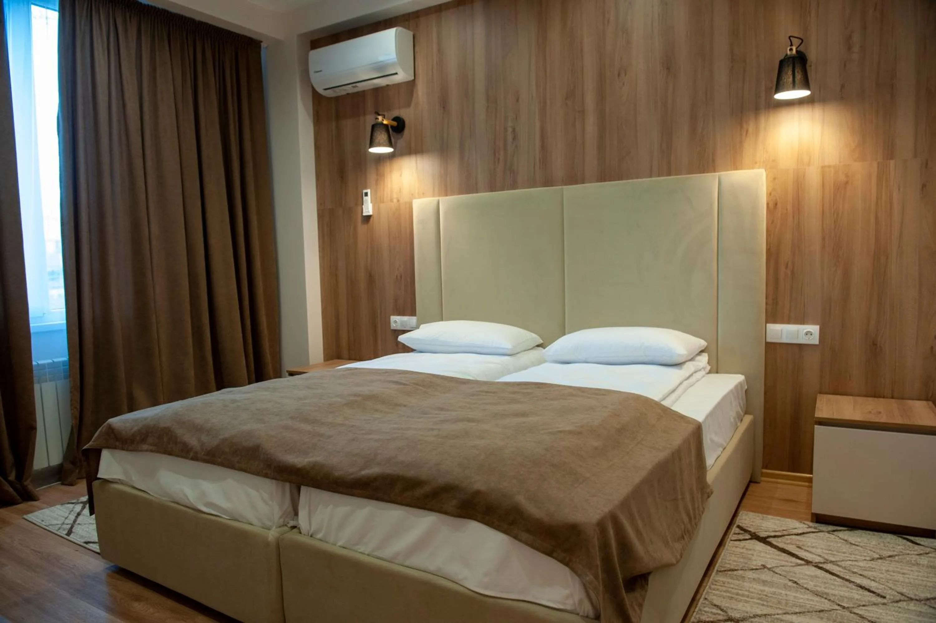Bed in Lotus Hotel Chisinau