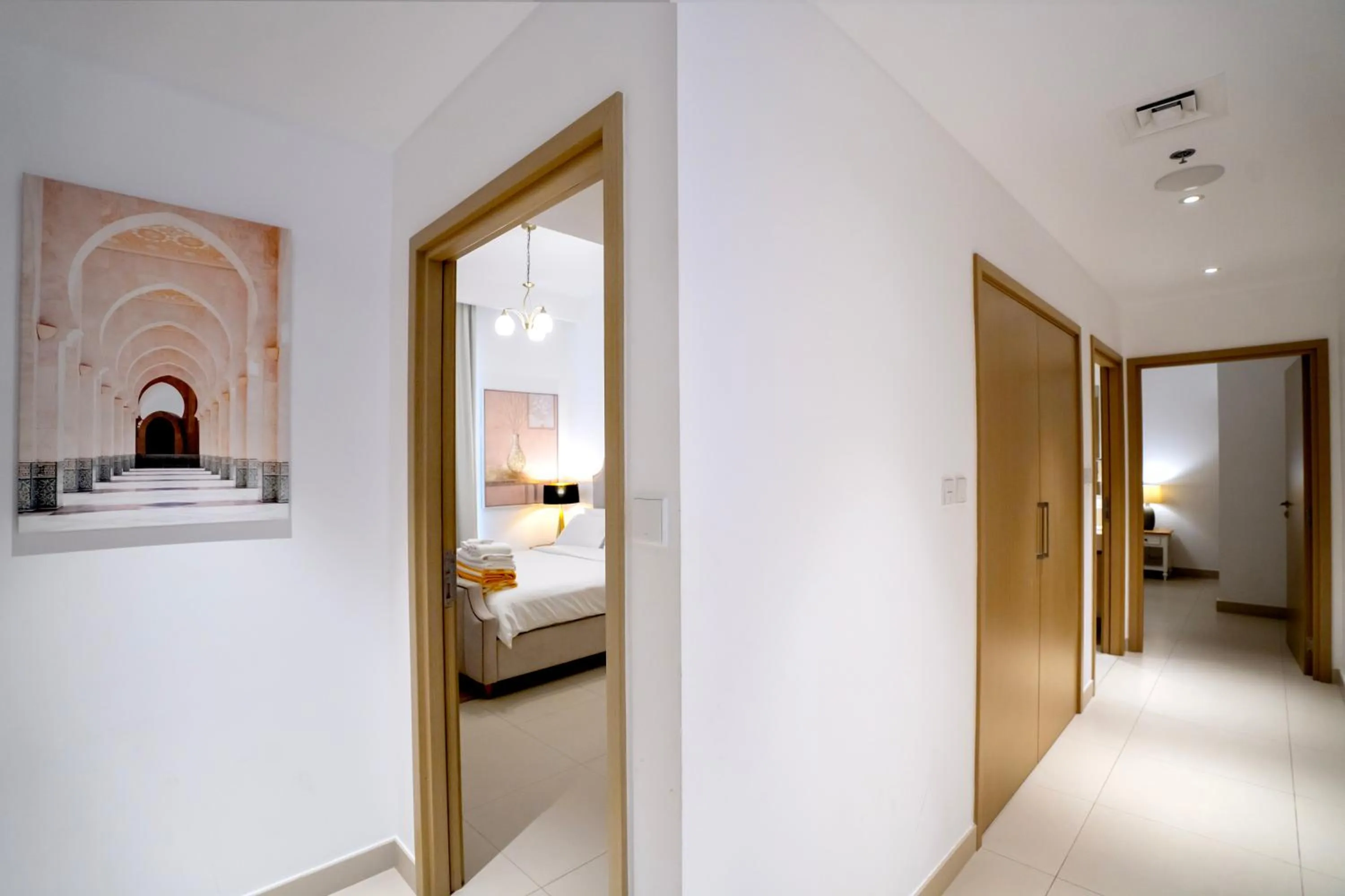 Bed in 3BR Haven with Burj Views by MagnoliasVHR