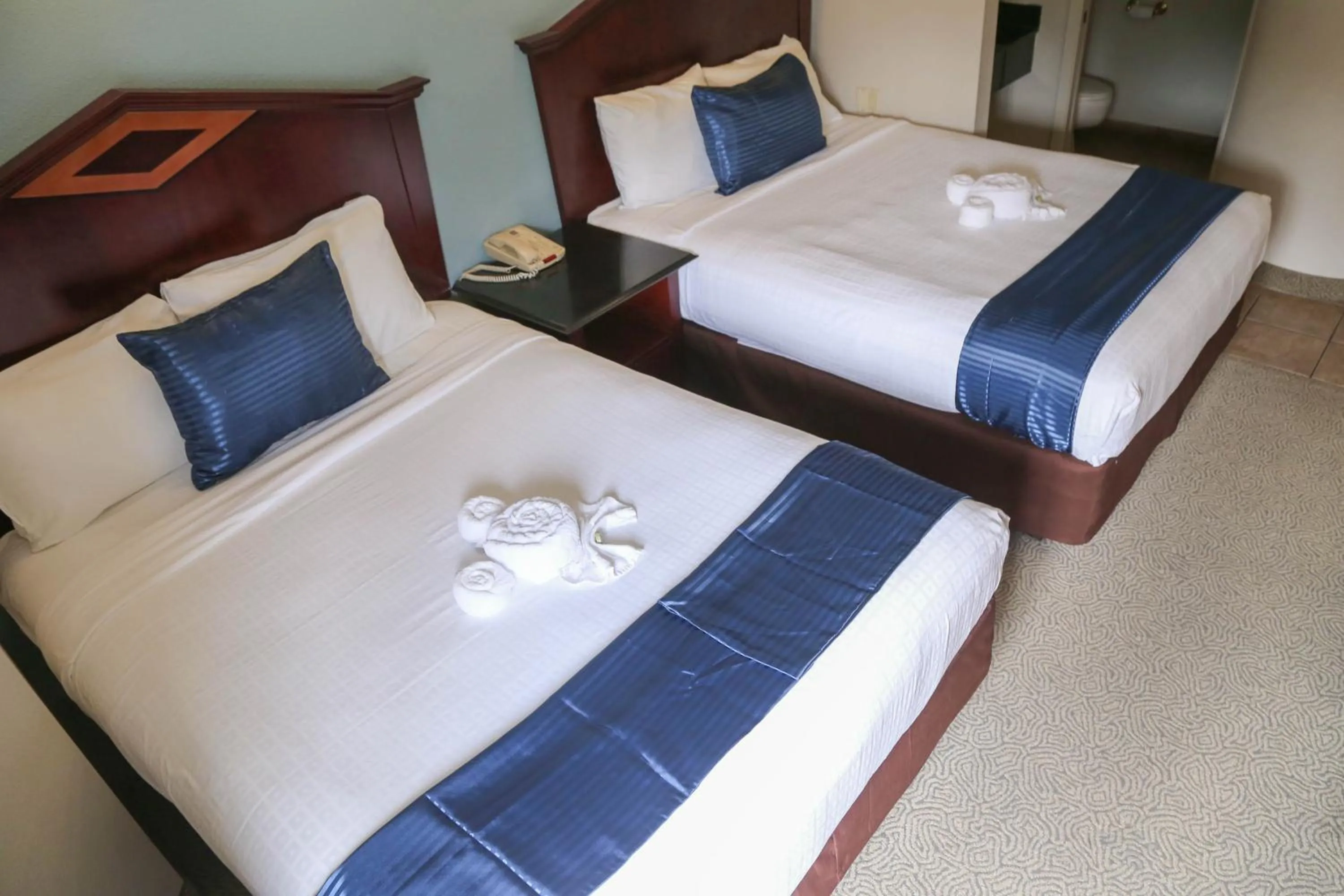 Photo of the whole room, Bed in Destiny Palms Hotel Maingate West