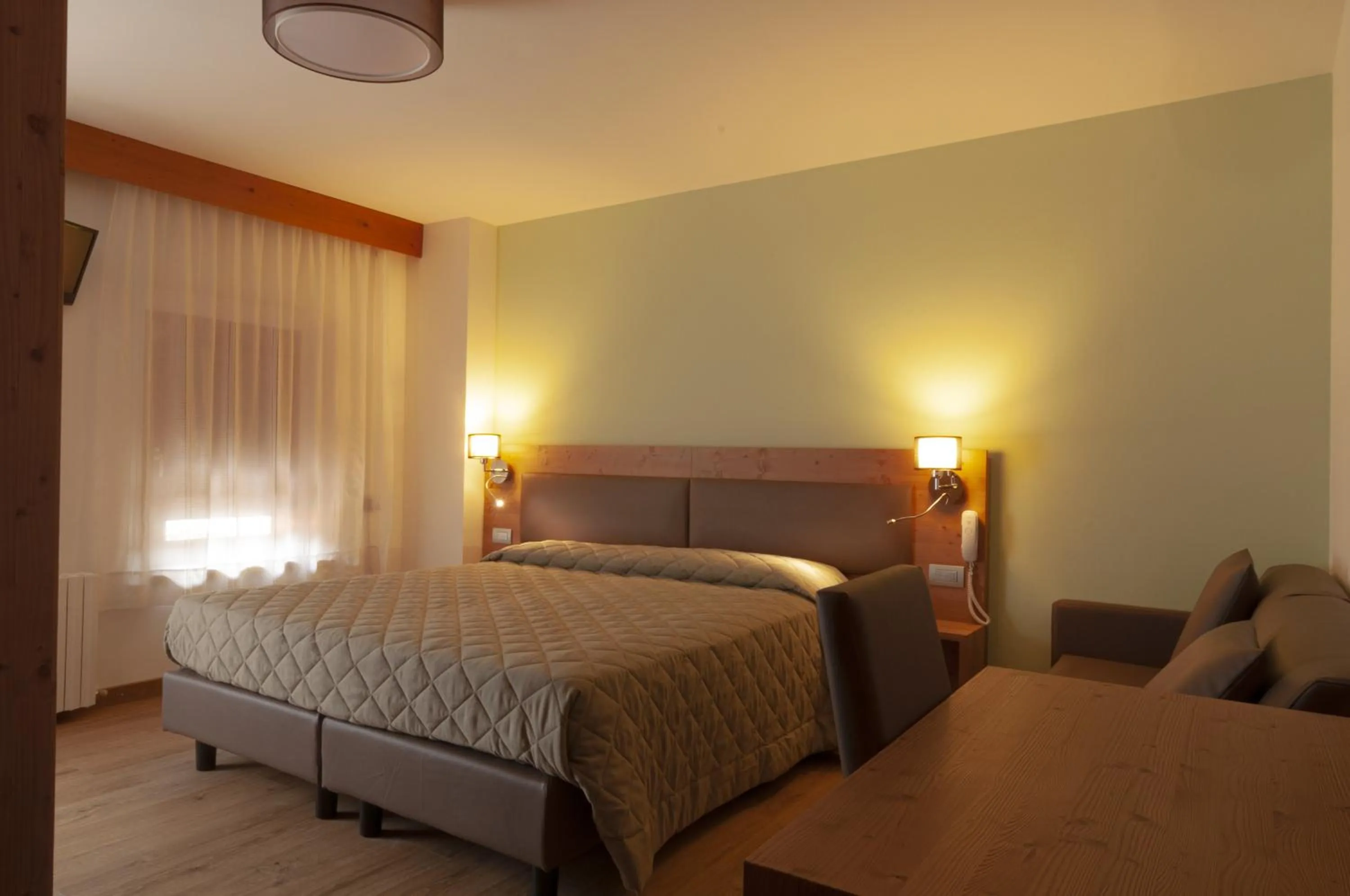 Bed in Albergo Antelao