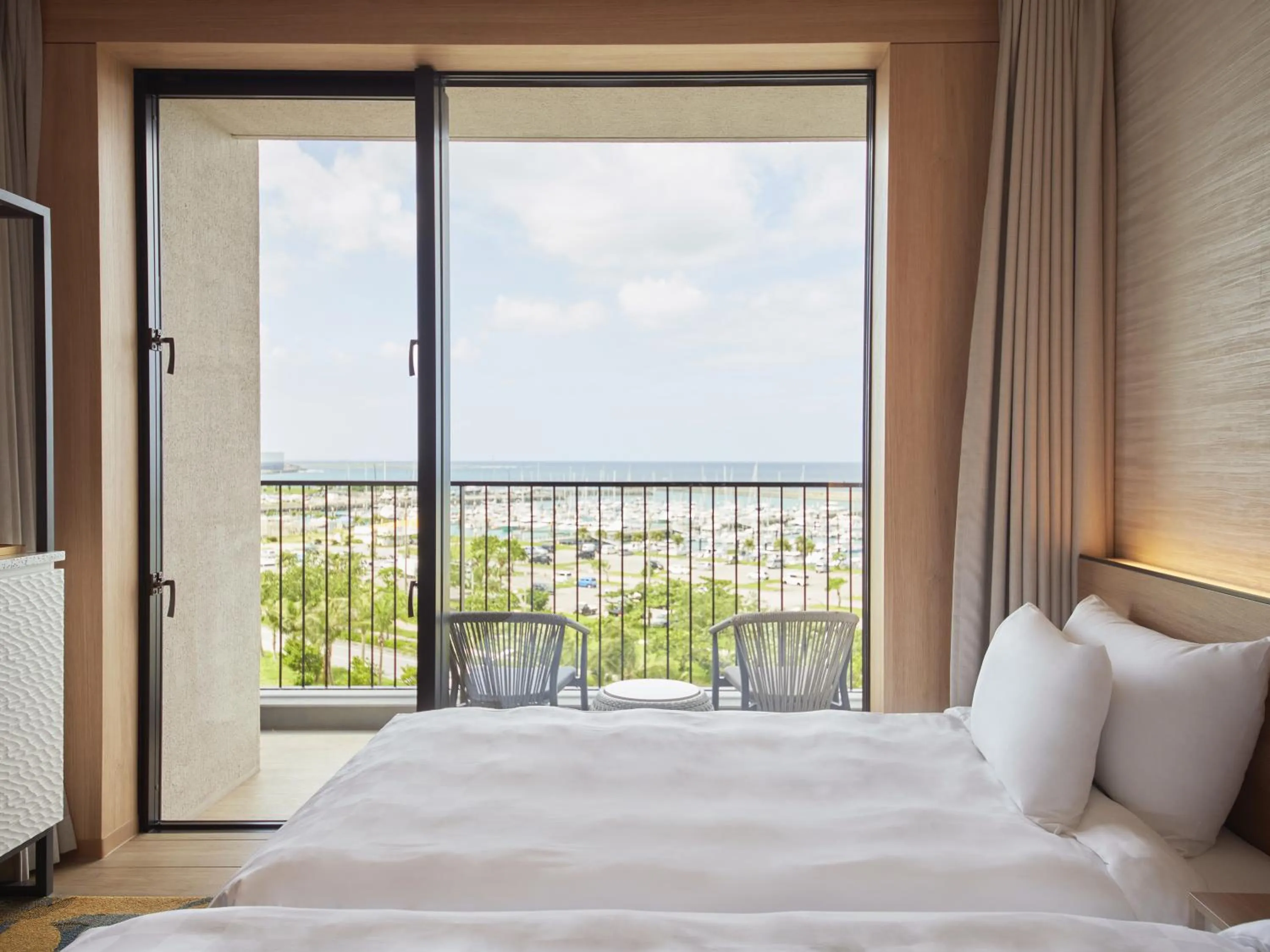 Balcony/Terrace, Bed in Okinawa Prince Hotel Ocean View Ginowan