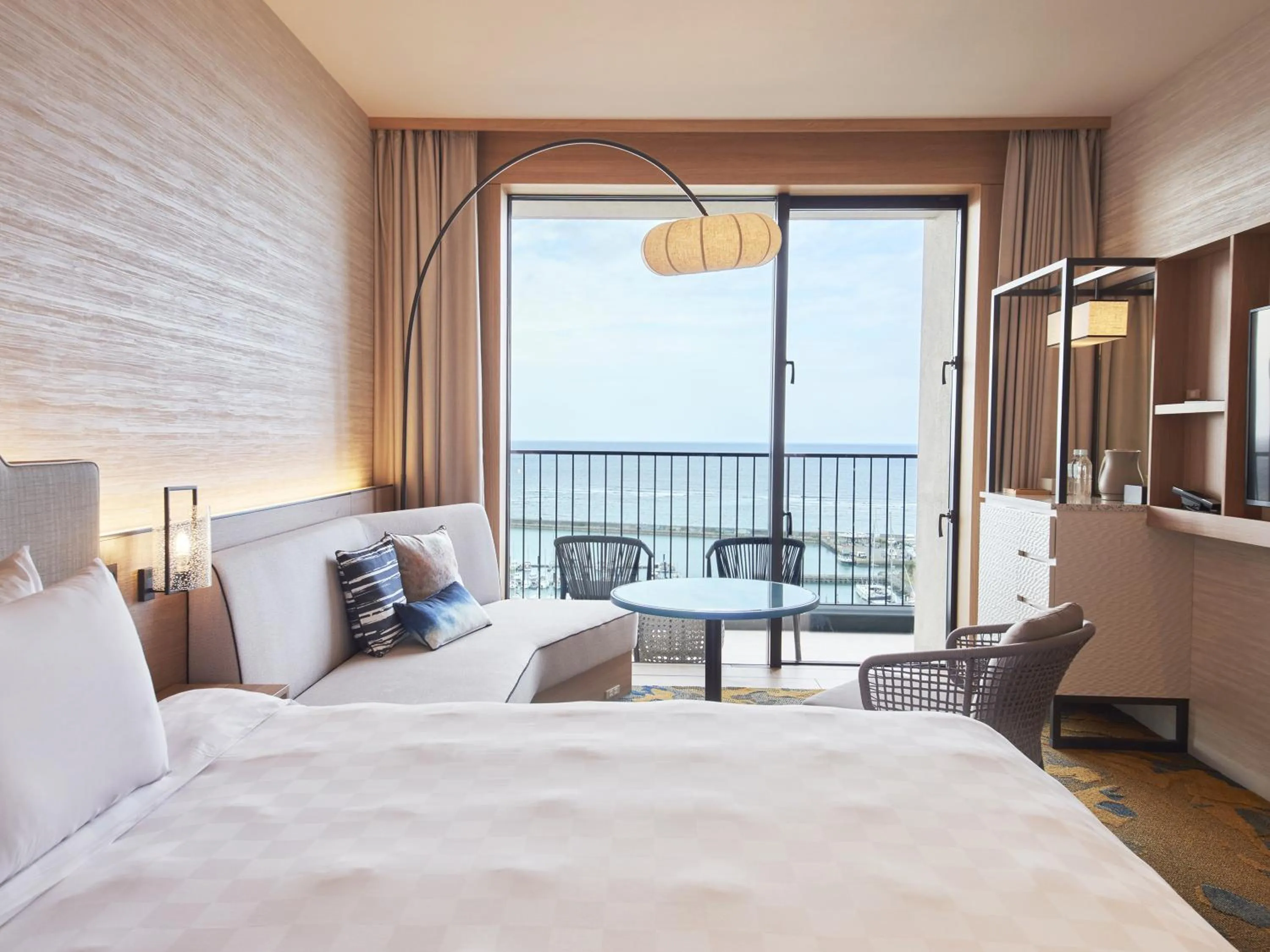 Balcony/Terrace, Bed in Okinawa Prince Hotel Ocean View Ginowan