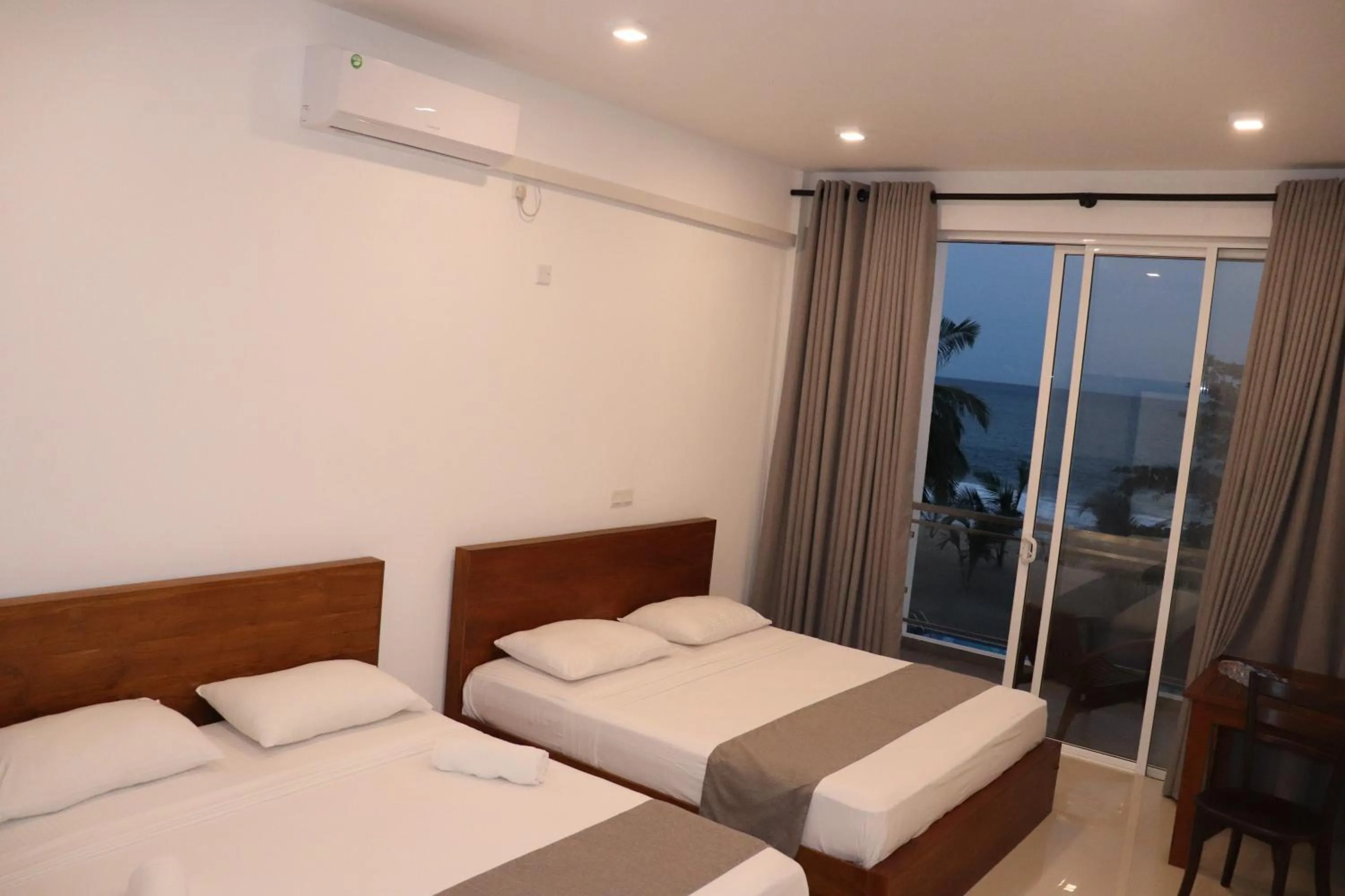 Bed in Marakolliya Beach Resort