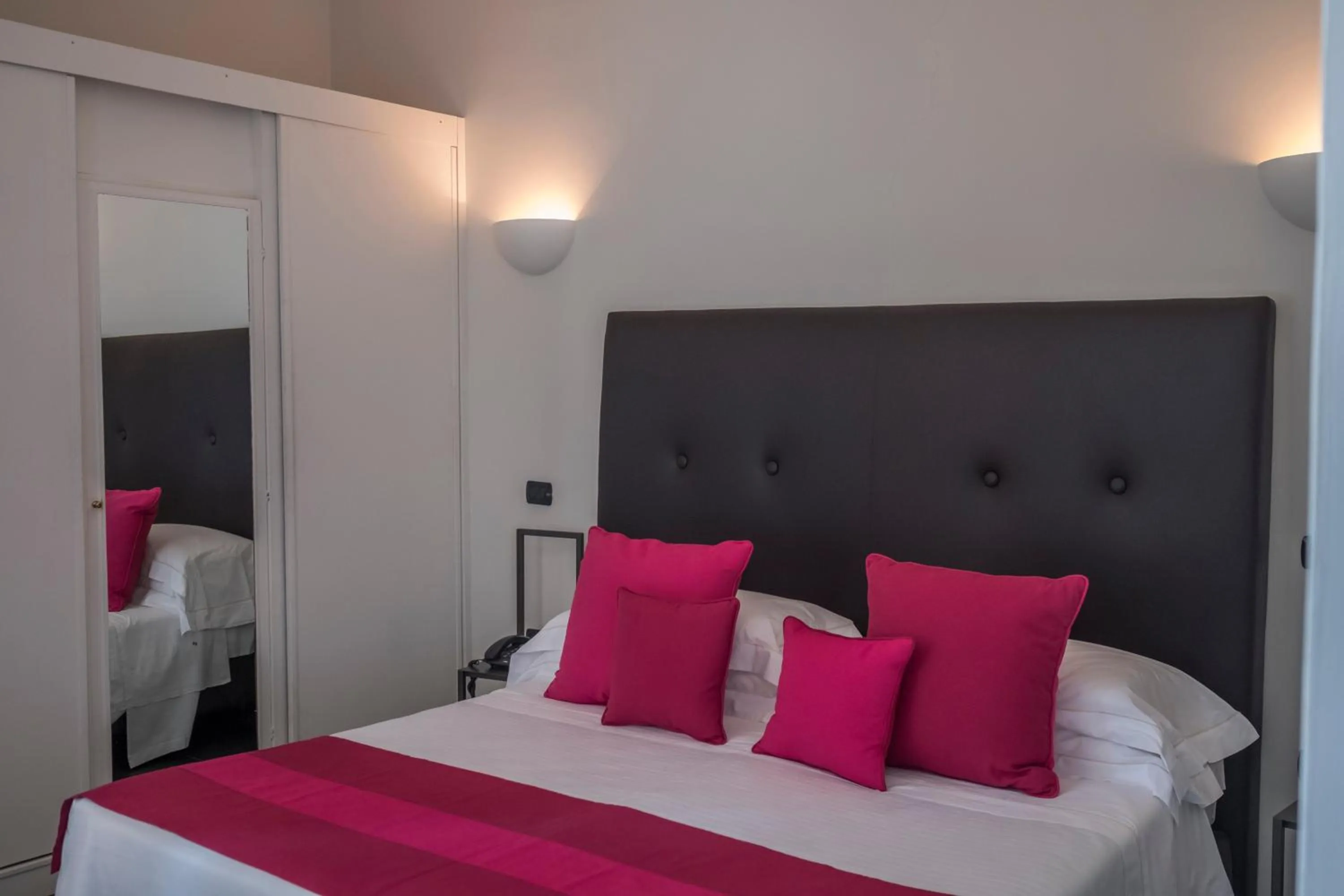 Bed in Majestic Palace Hotel