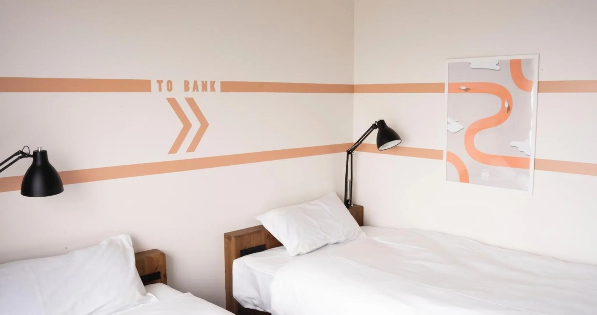 Bed in SETOUCHI KEIRIN HOTEL 10 by Onko Chishin