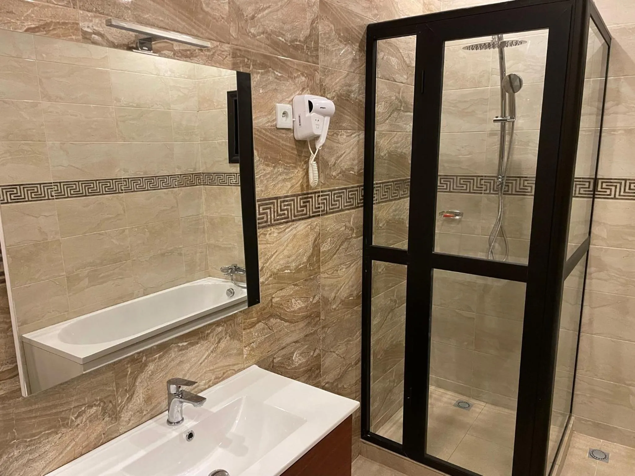 Shower in HOTEL LES ARCADES