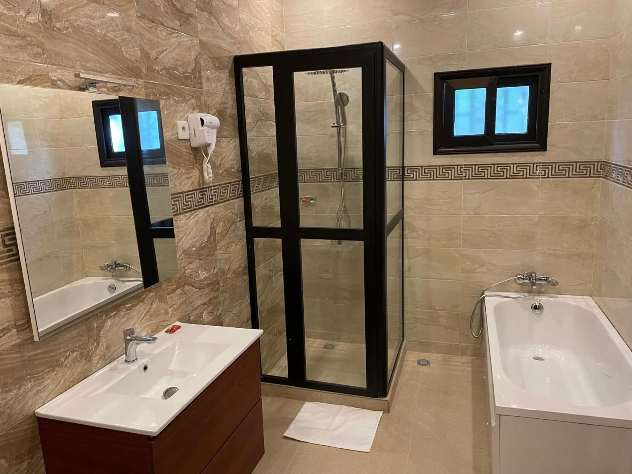 Shower in HOTEL LES ARCADES