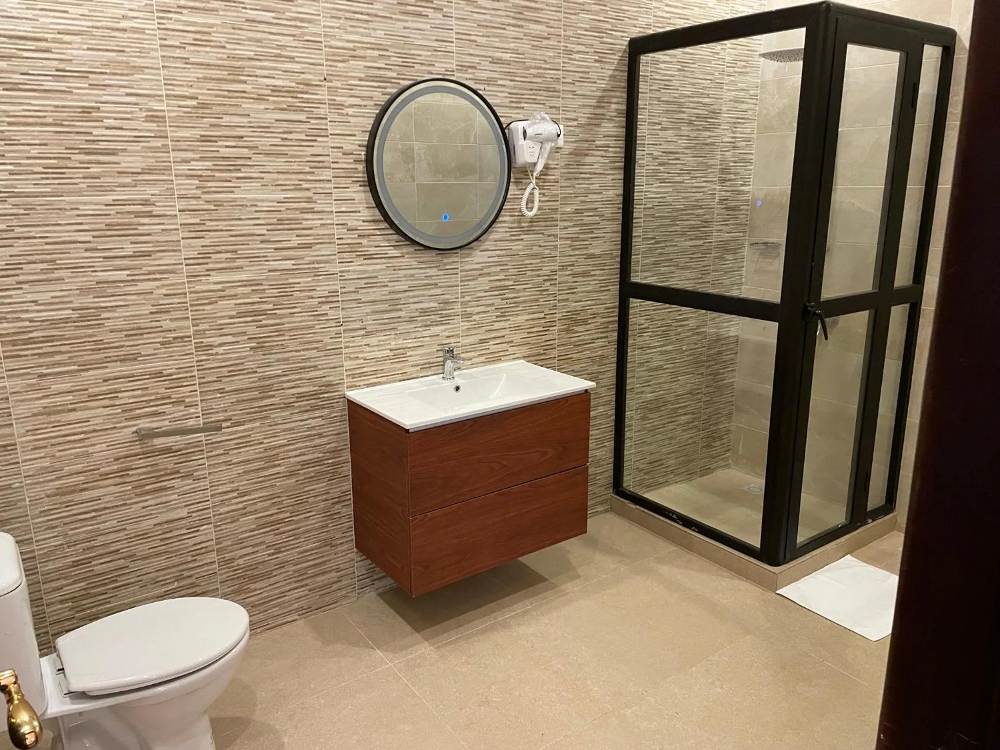 Shower in HOTEL LES ARCADES