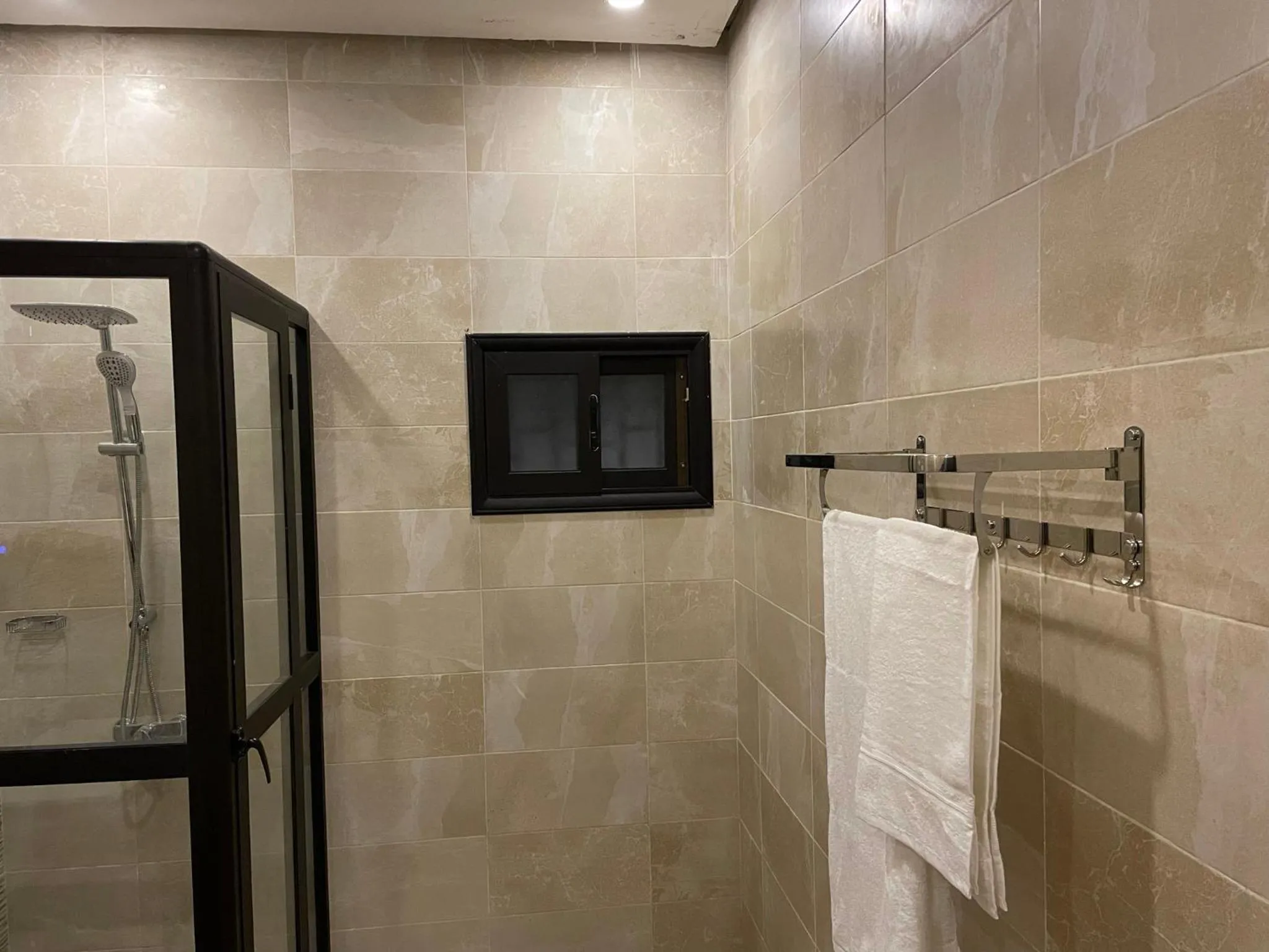 Shower in HOTEL LES ARCADES