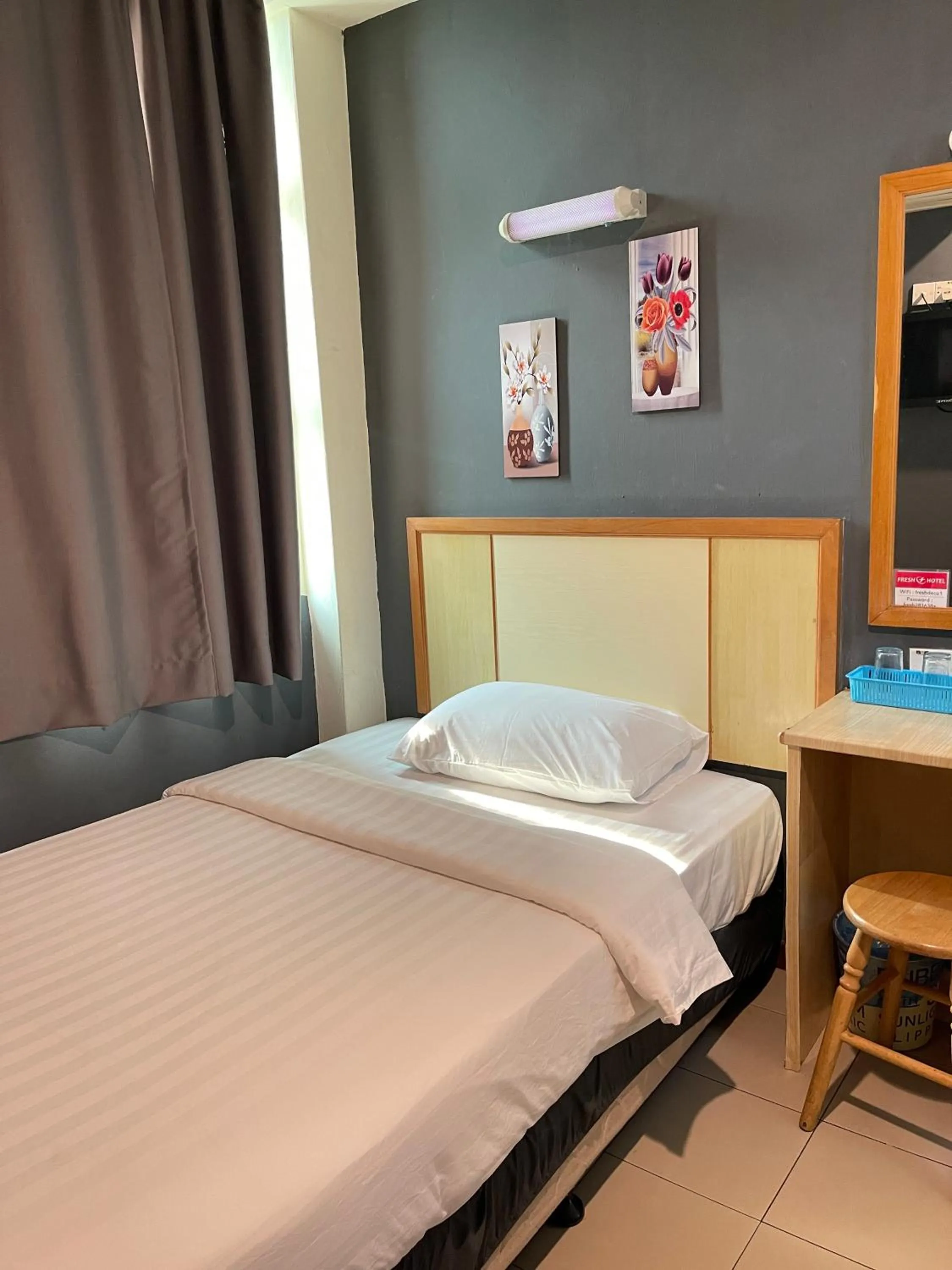 Bed in Fresh Hotel Falim