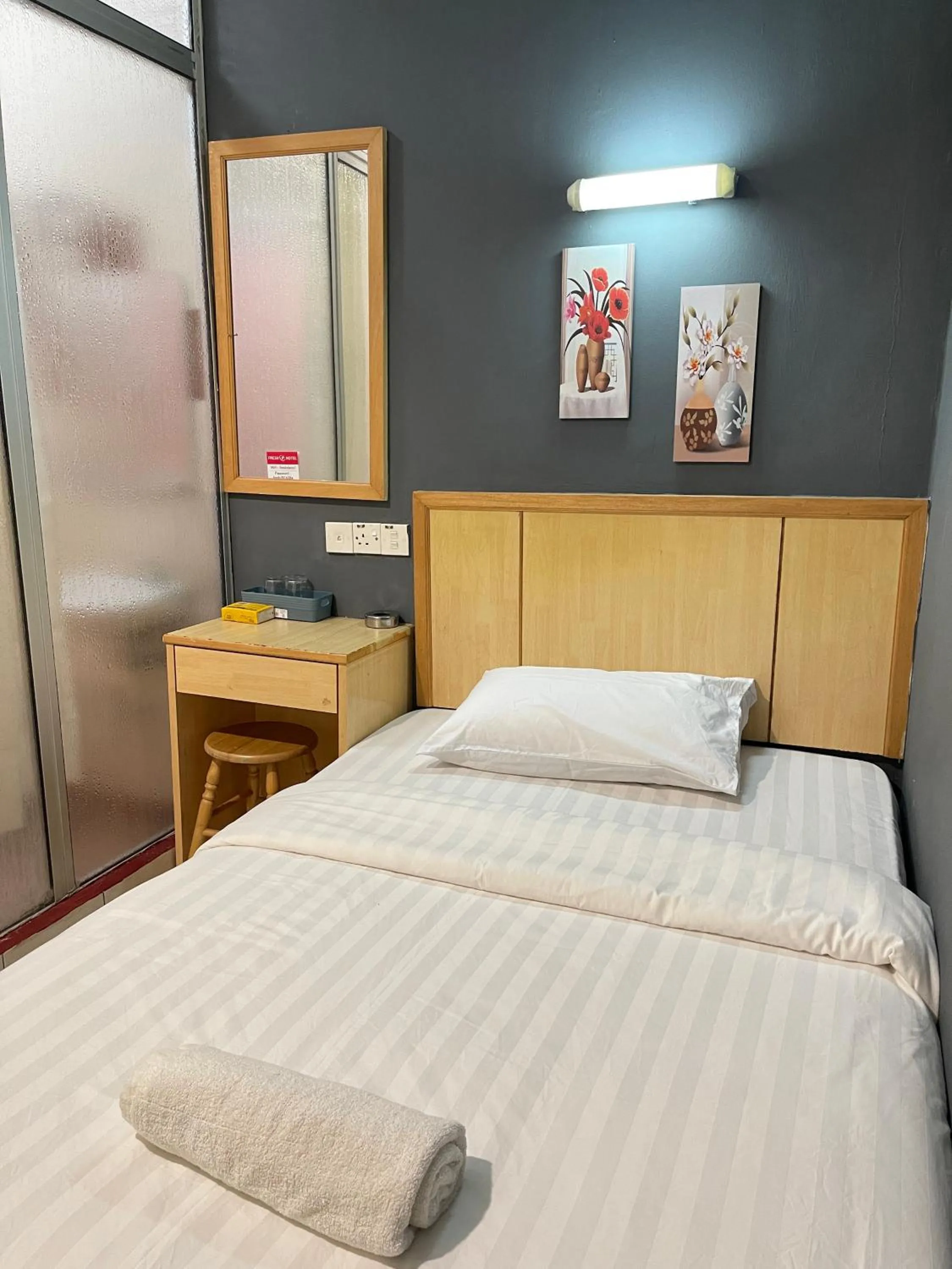 Bed in Fresh Hotel Falim