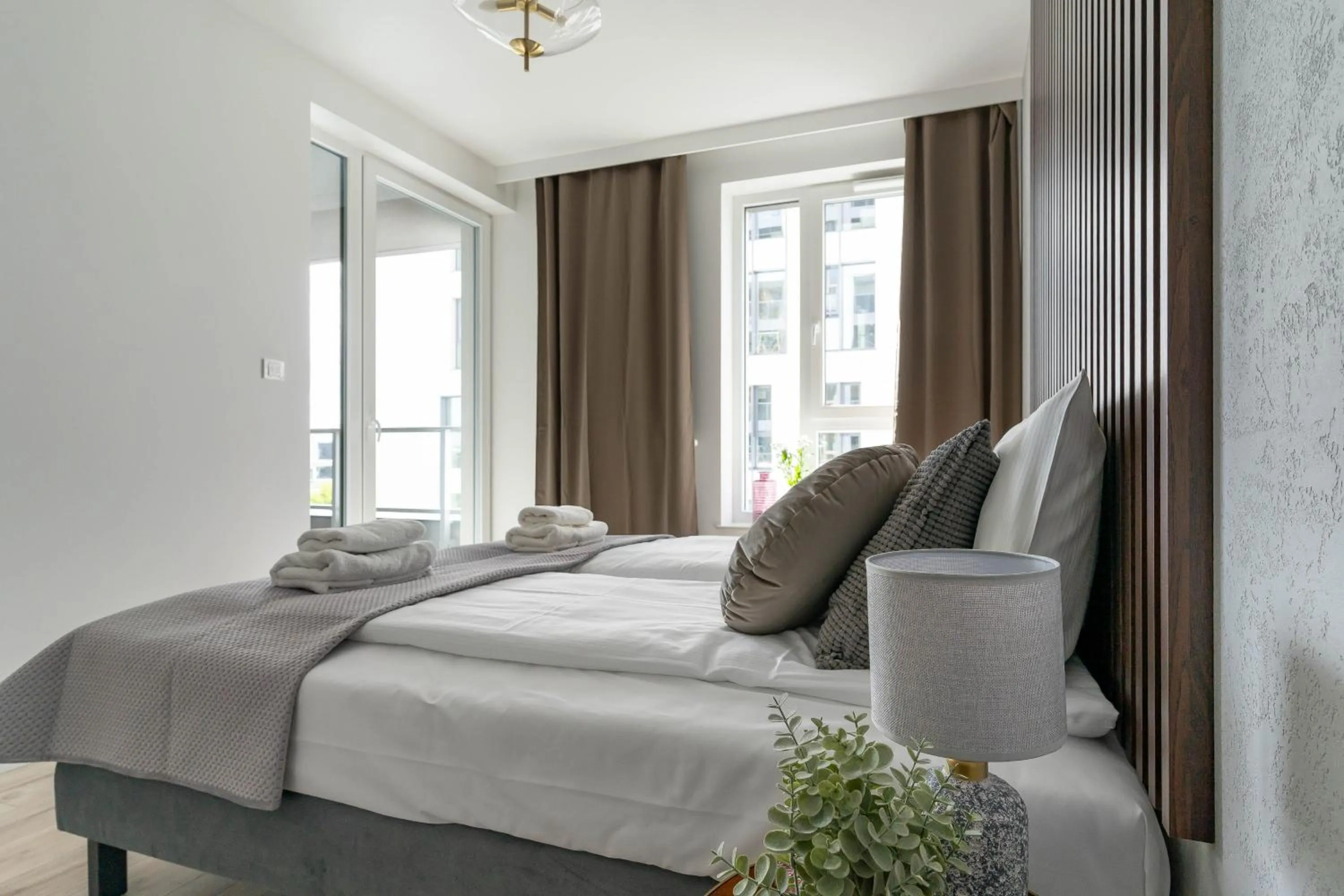 Bed in Symphony Modern Tower Apartamenty