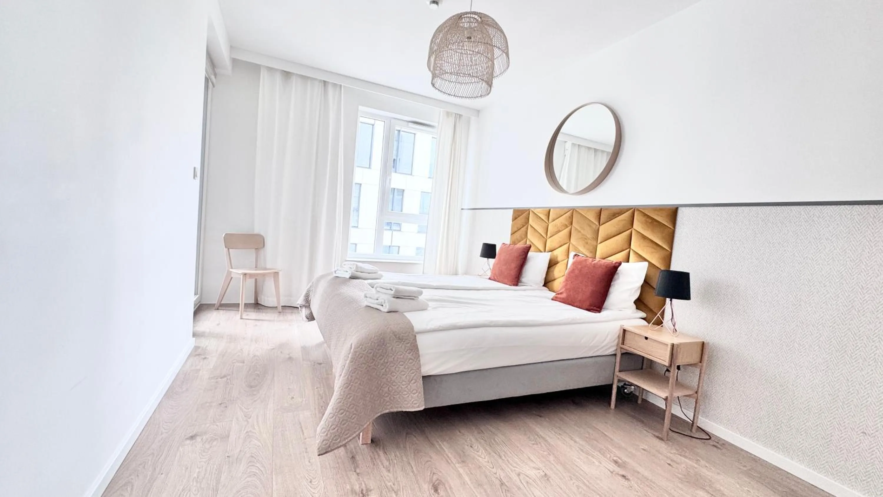 Bed in Symphony Modern Tower Apartamenty