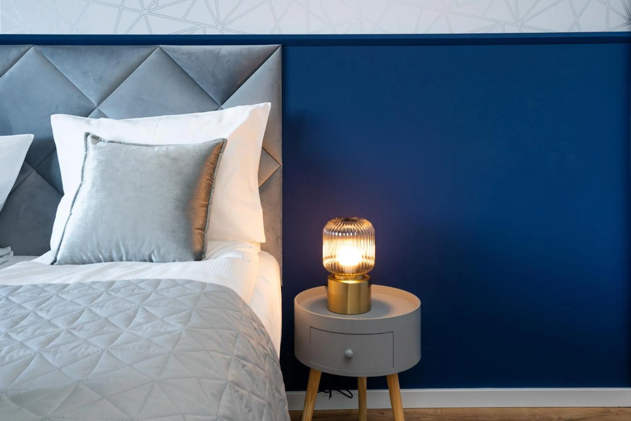 Bed in Symphony Modern Tower Apartamenty