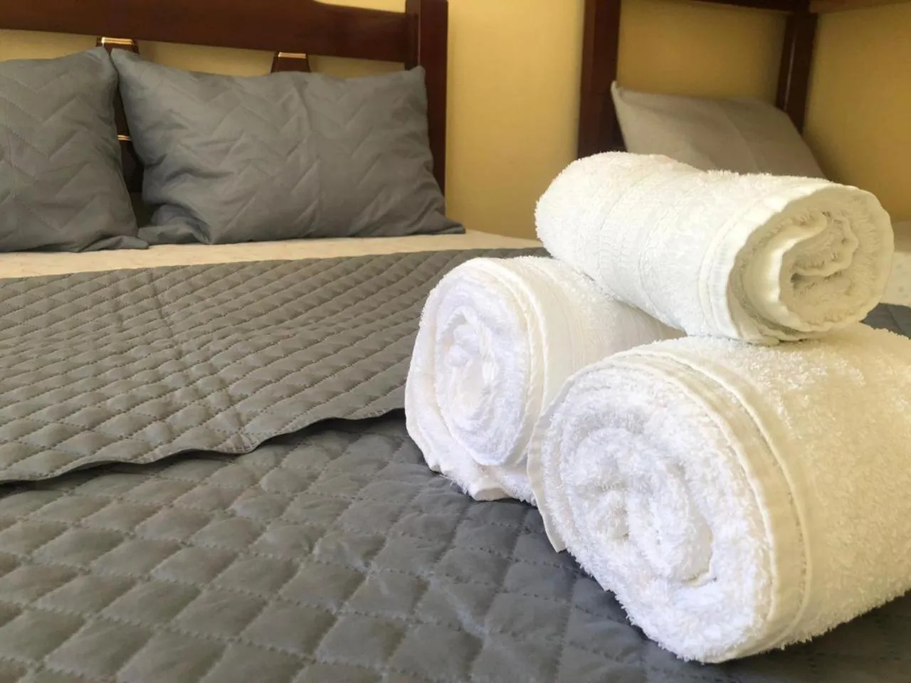 Bed in Pousada Frezza Mergulho