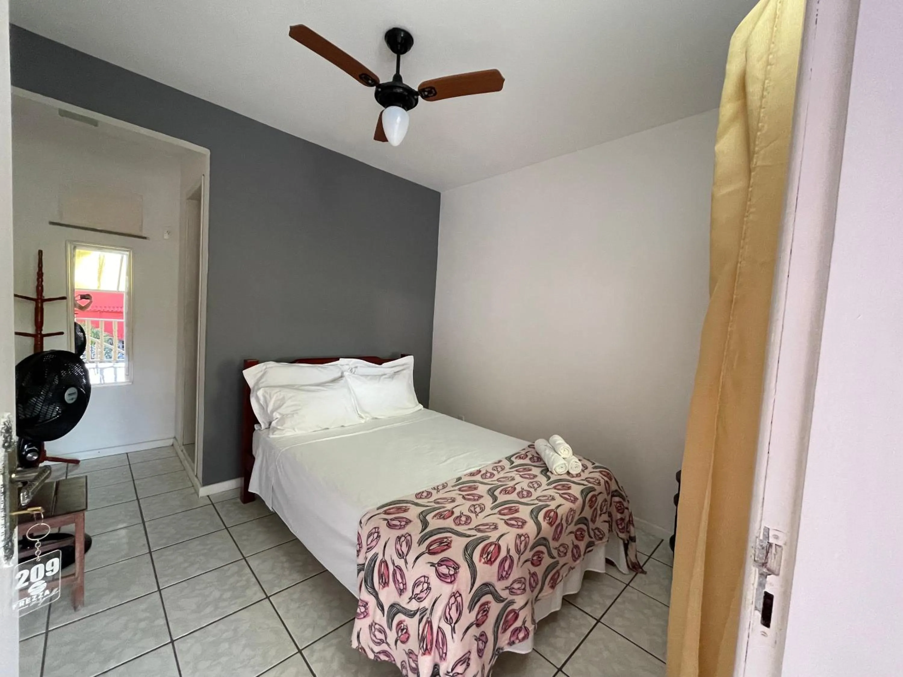 Bed in Pousada Frezza Mergulho