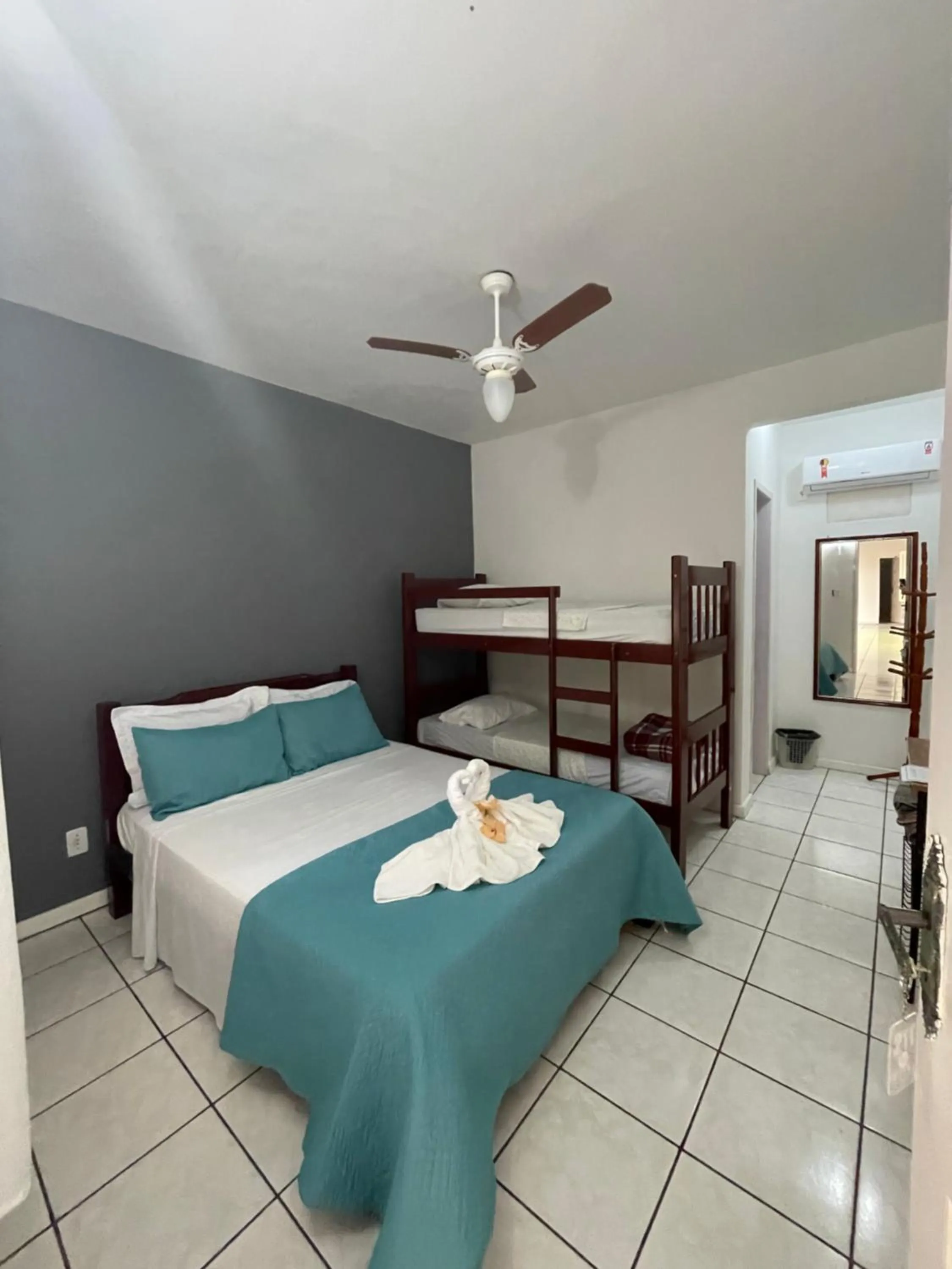 Bed in Pousada Frezza Mergulho