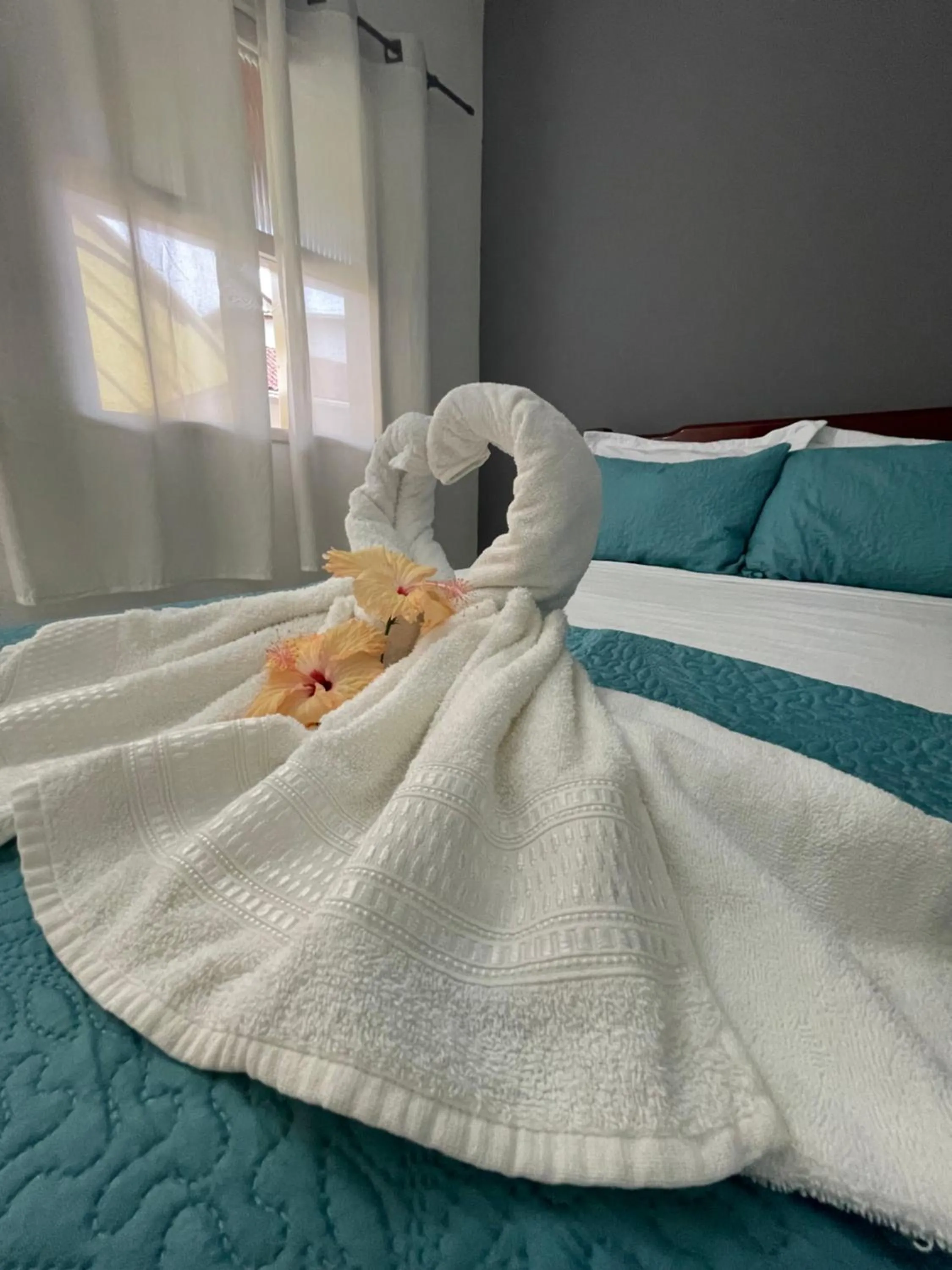 Bed in Pousada Frezza Mergulho