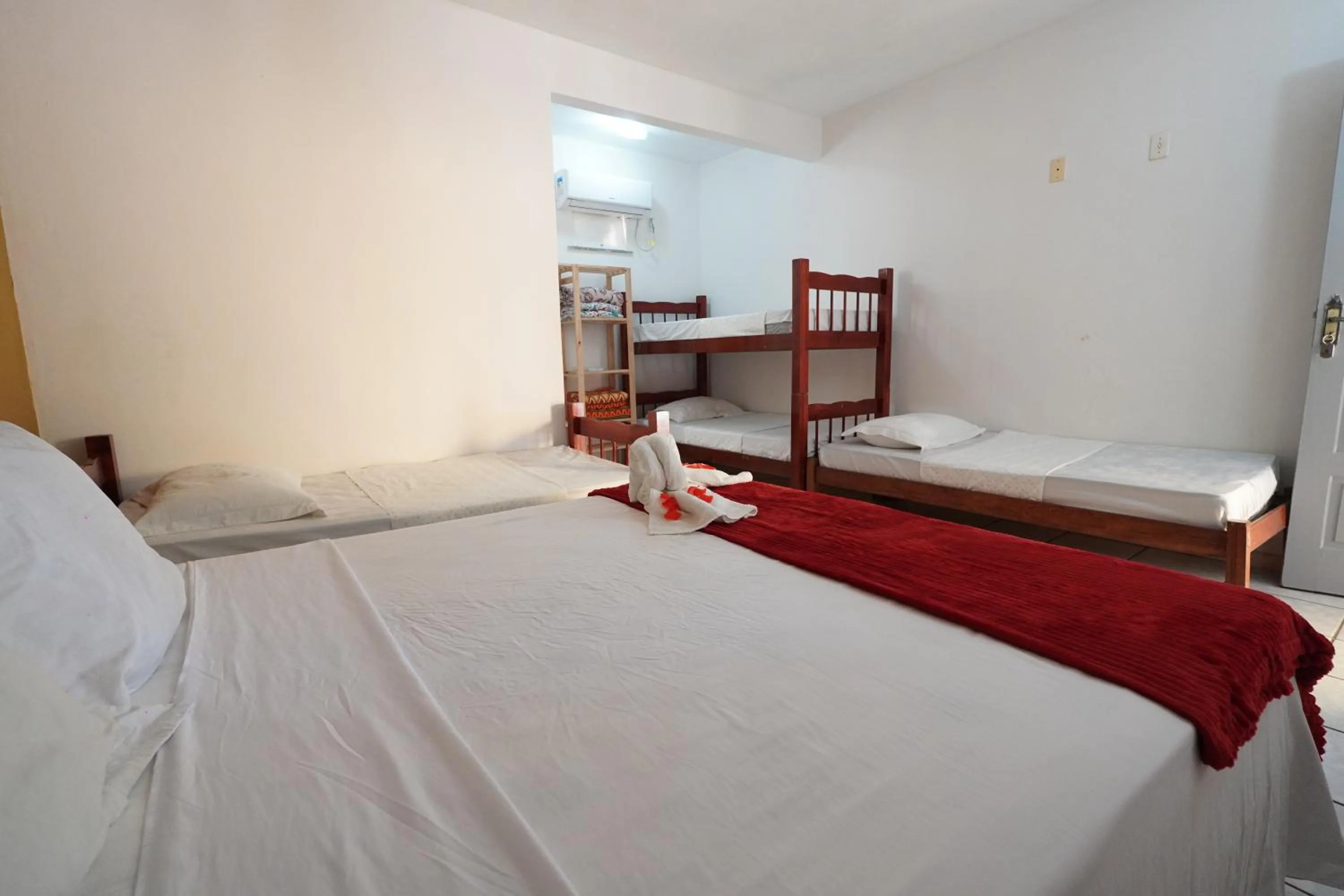 Bed in Pousada Frezza Mergulho