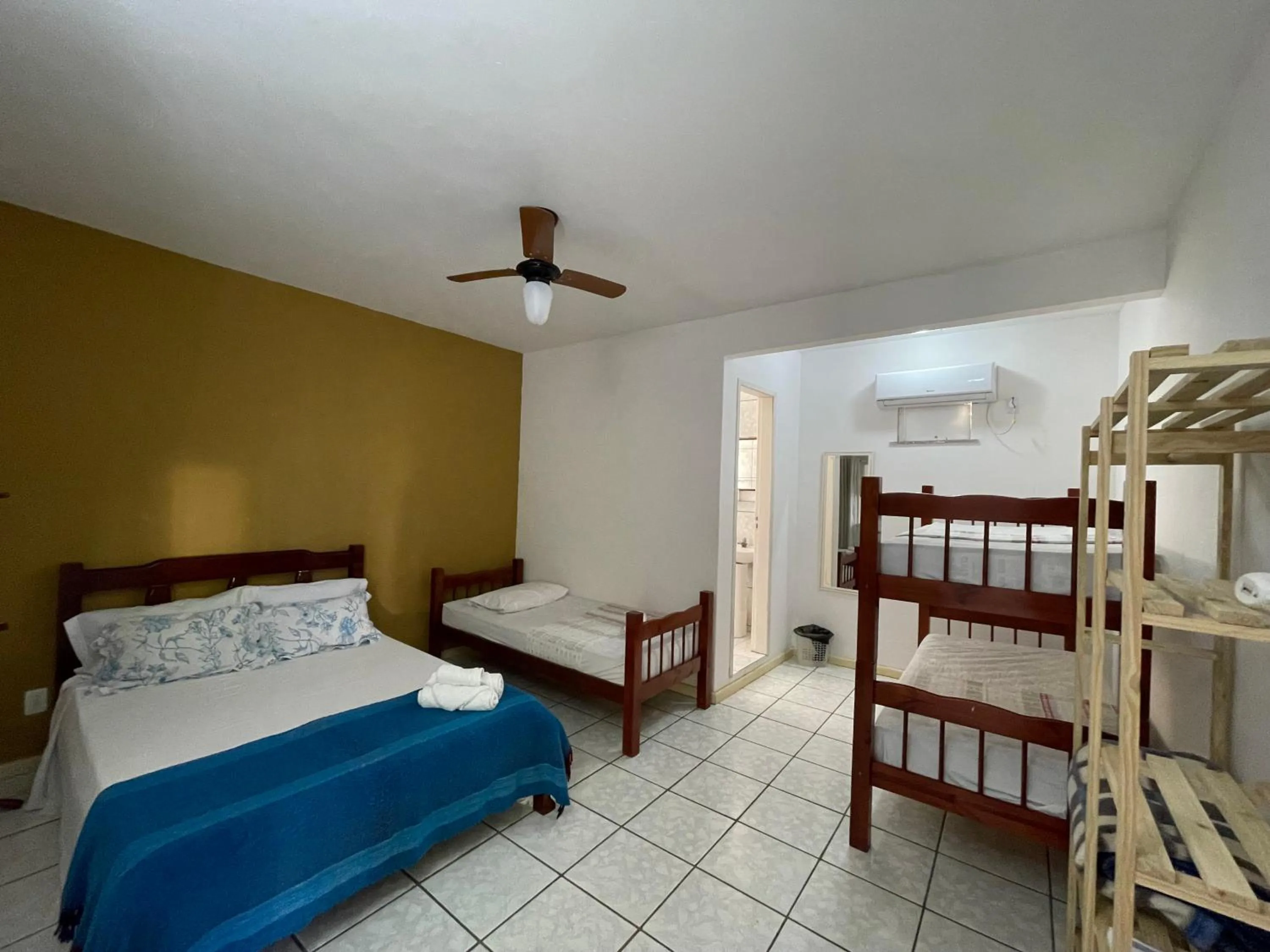 Bed in Pousada Frezza Mergulho