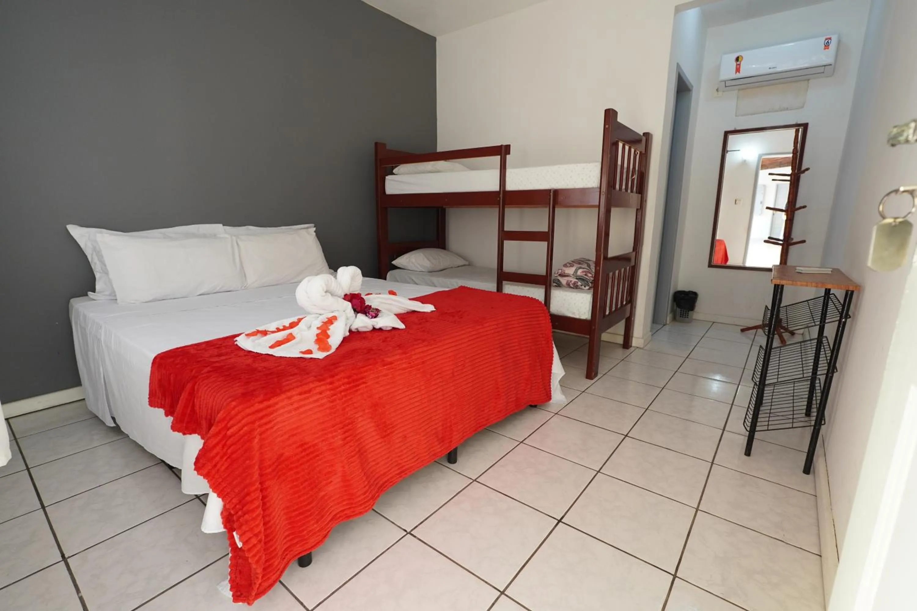 Bed in Pousada Frezza Mergulho