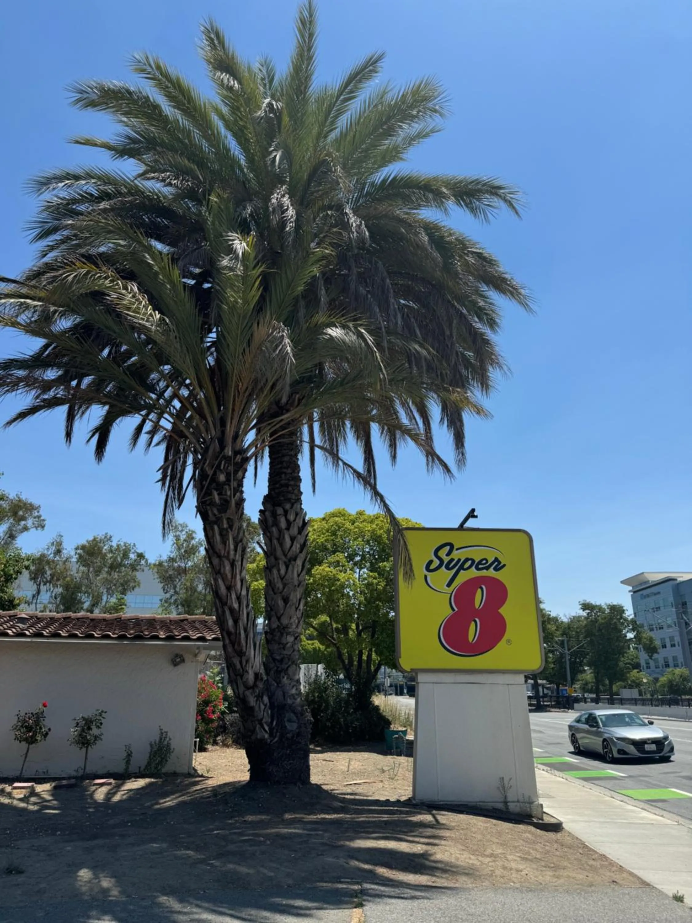 Property logo or sign in Super 8 by Wyndham San Jose Airport