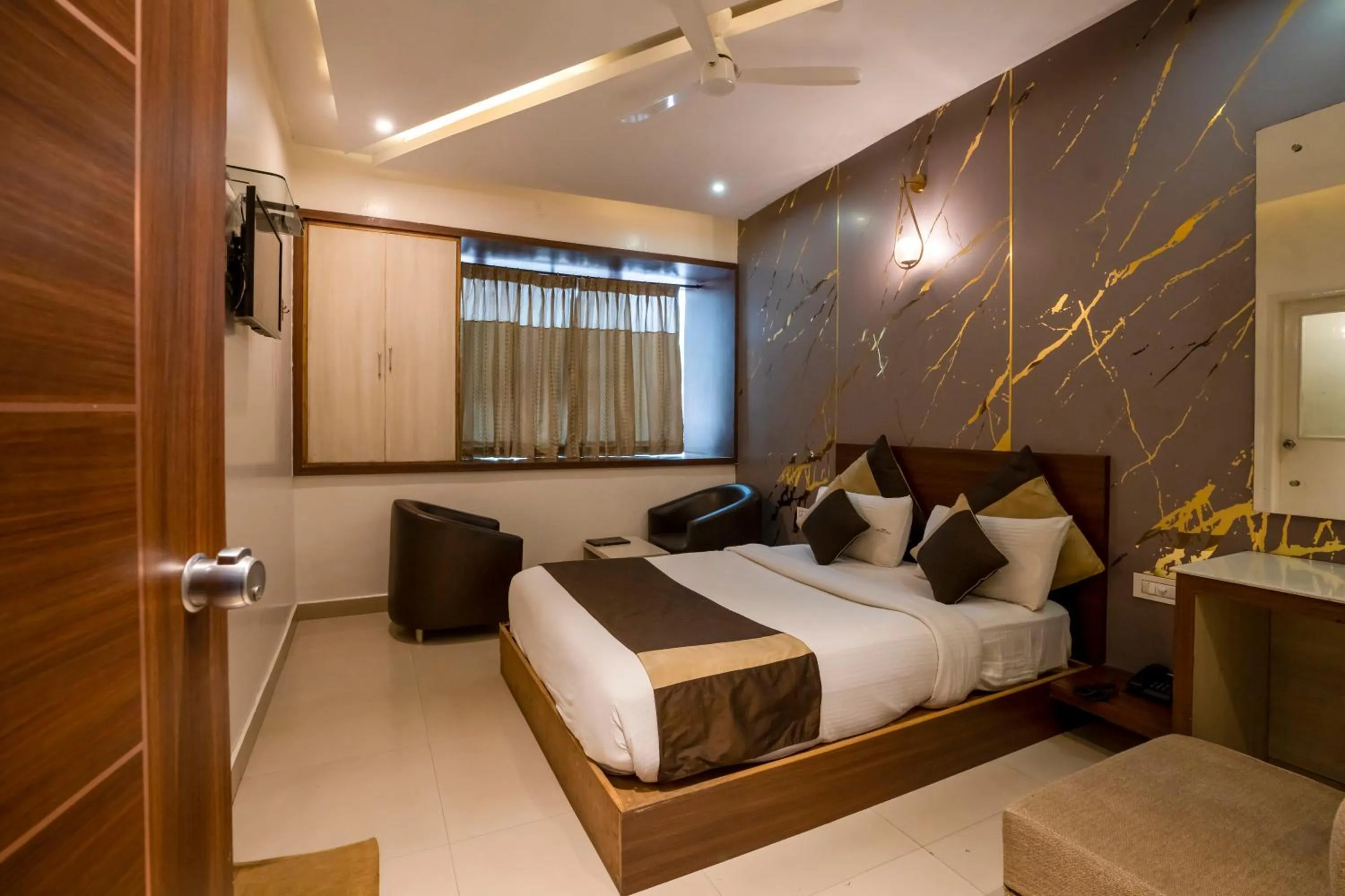Bed in Aishwarya Suites