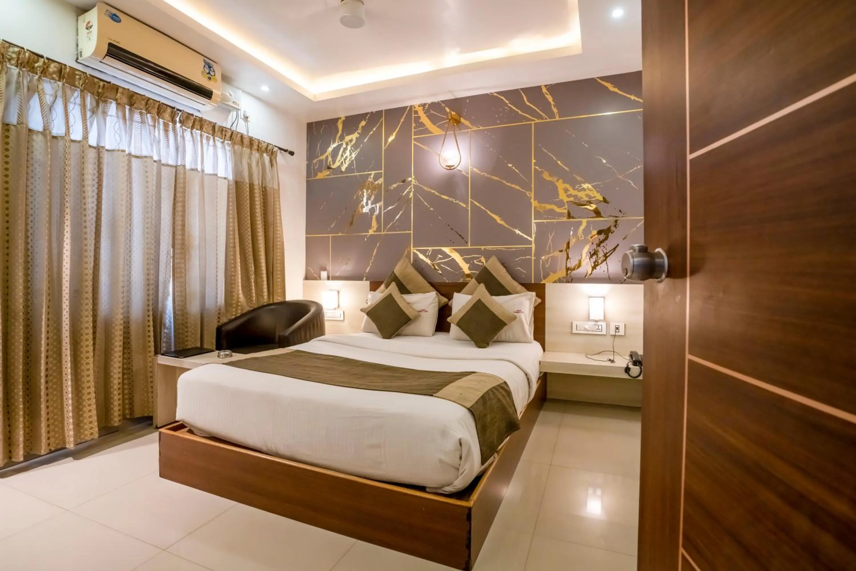 Bed in Aishwarya Suites