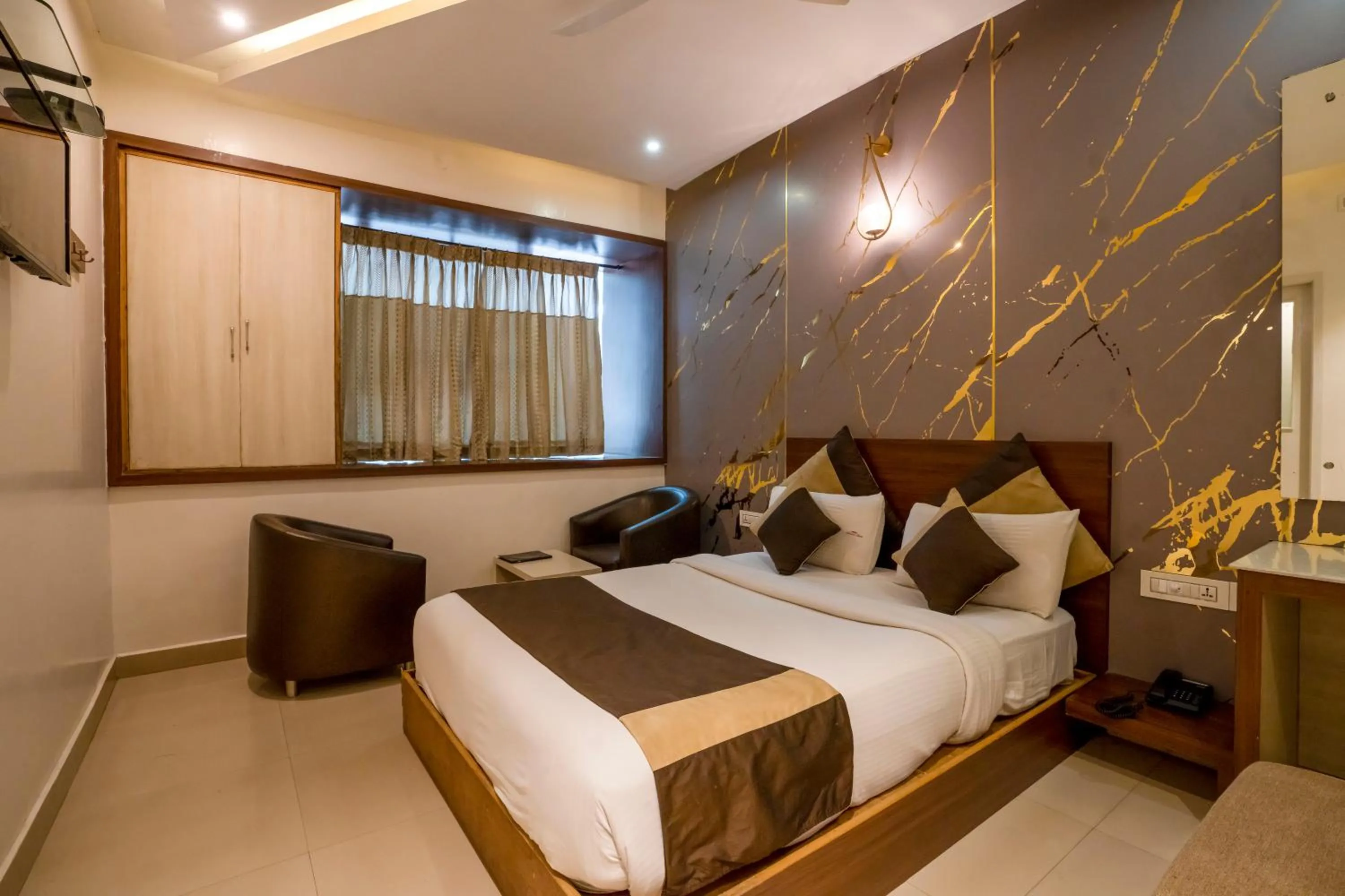 Bed in Aishwarya Suites