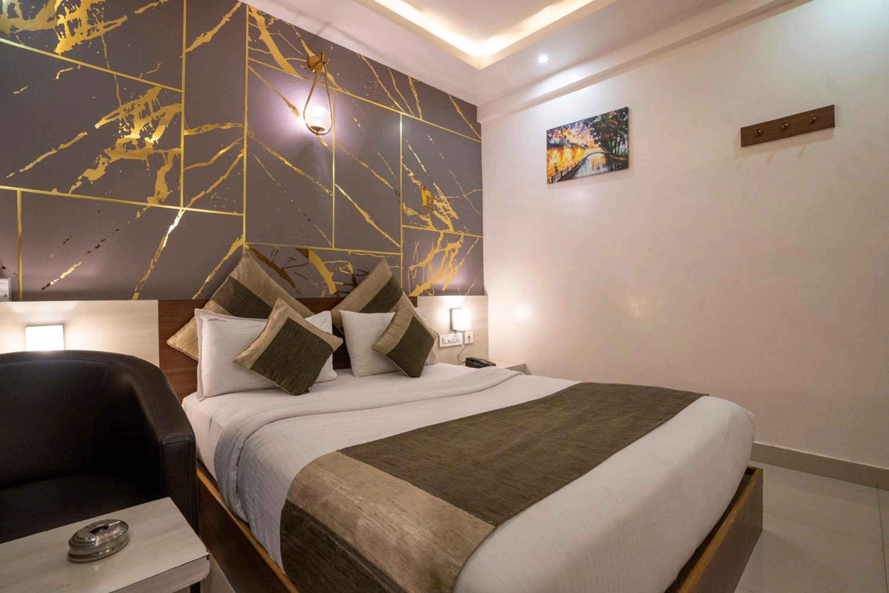 Bed in Aishwarya Suites