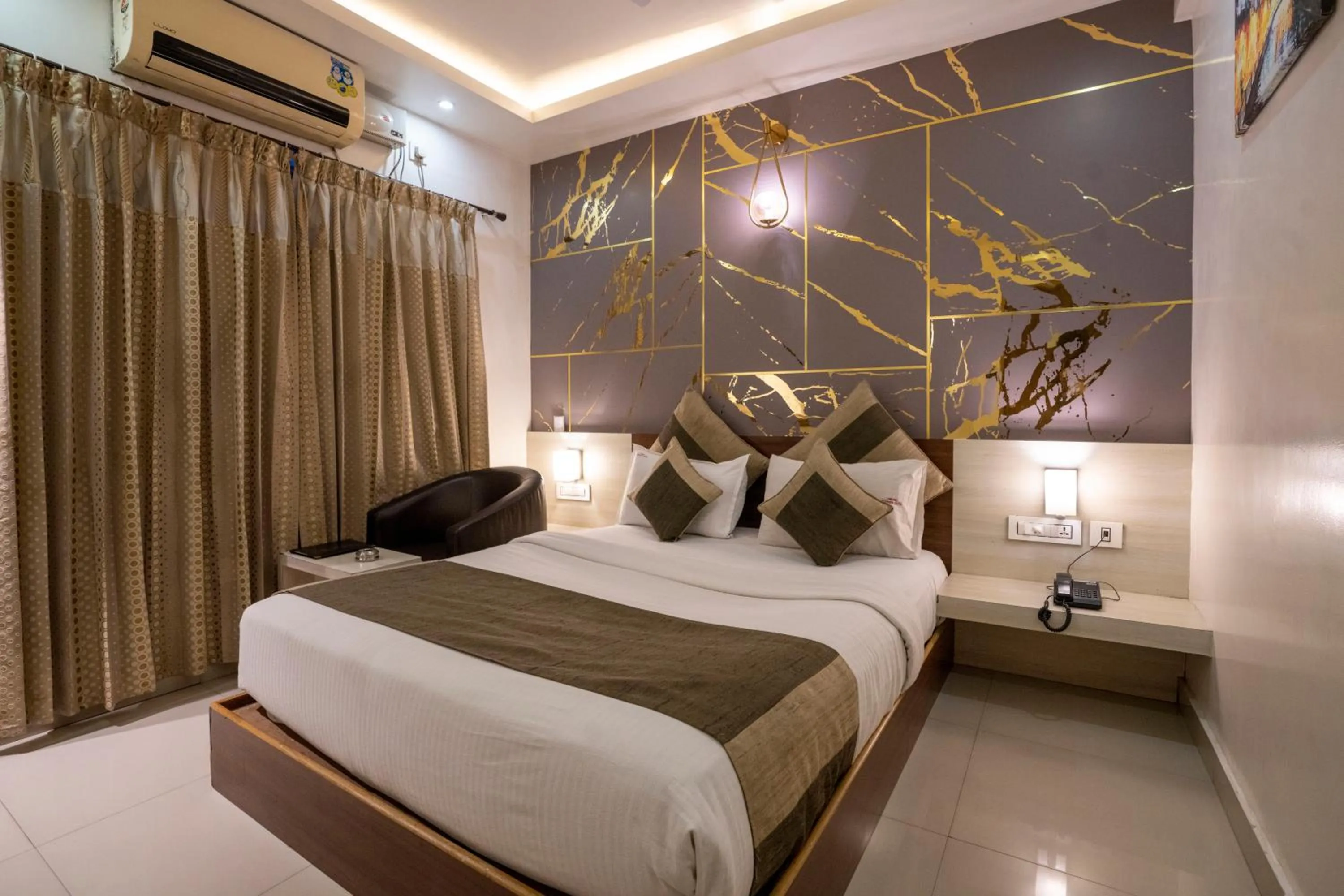 Bed in Aishwarya Suites