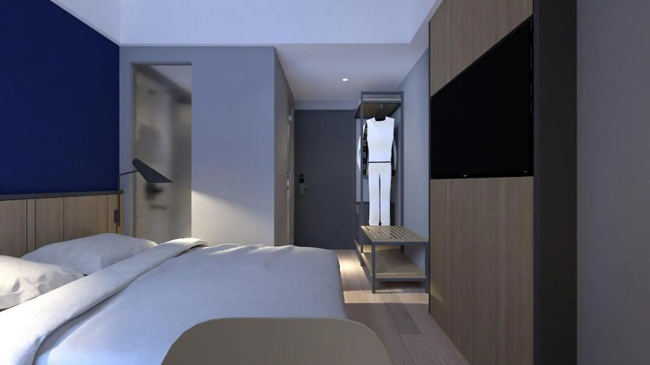 Bed in LeGreen Suite Sudirman