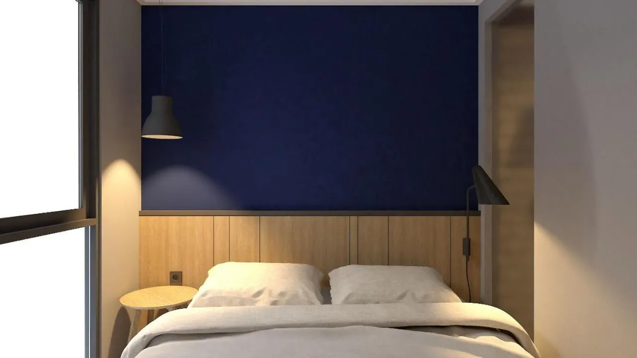 Bed in LeGreen Suite Sudirman