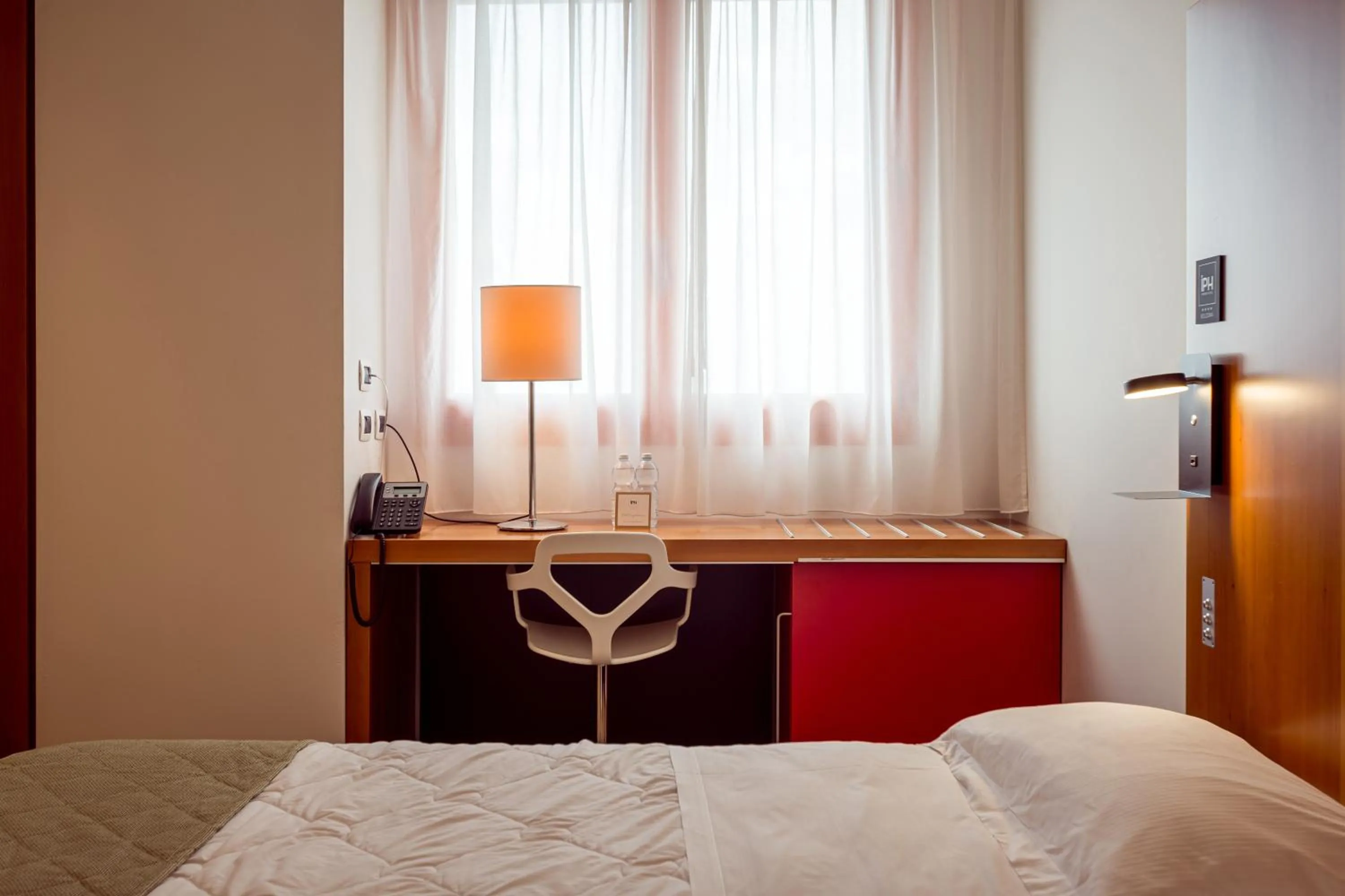 Bed in NEW IPOINT HOTEL