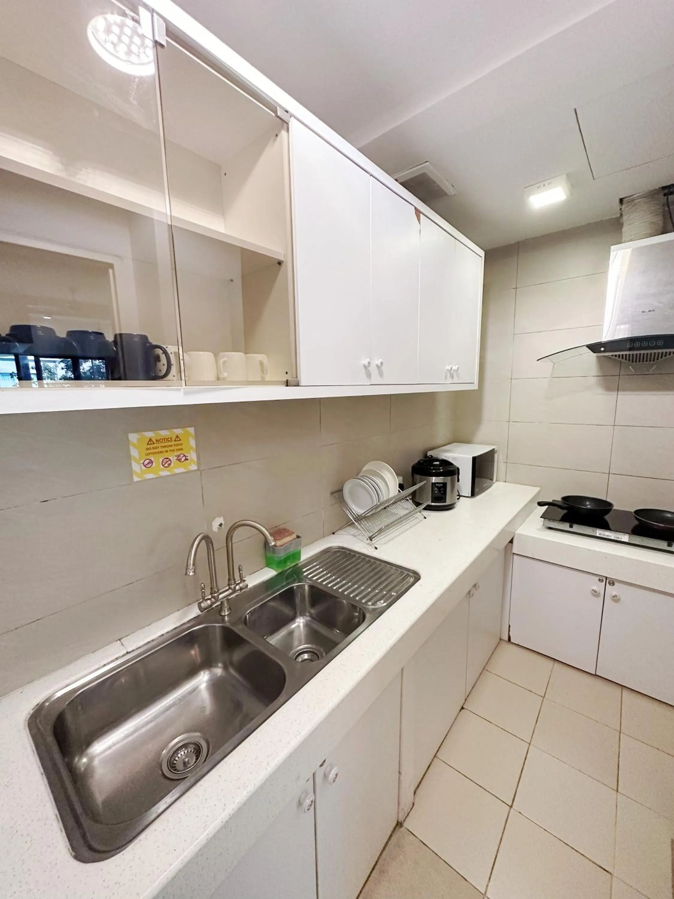 Kitchen or kitchenette in Mari Mari Homestay - IMAGO THE LOFT